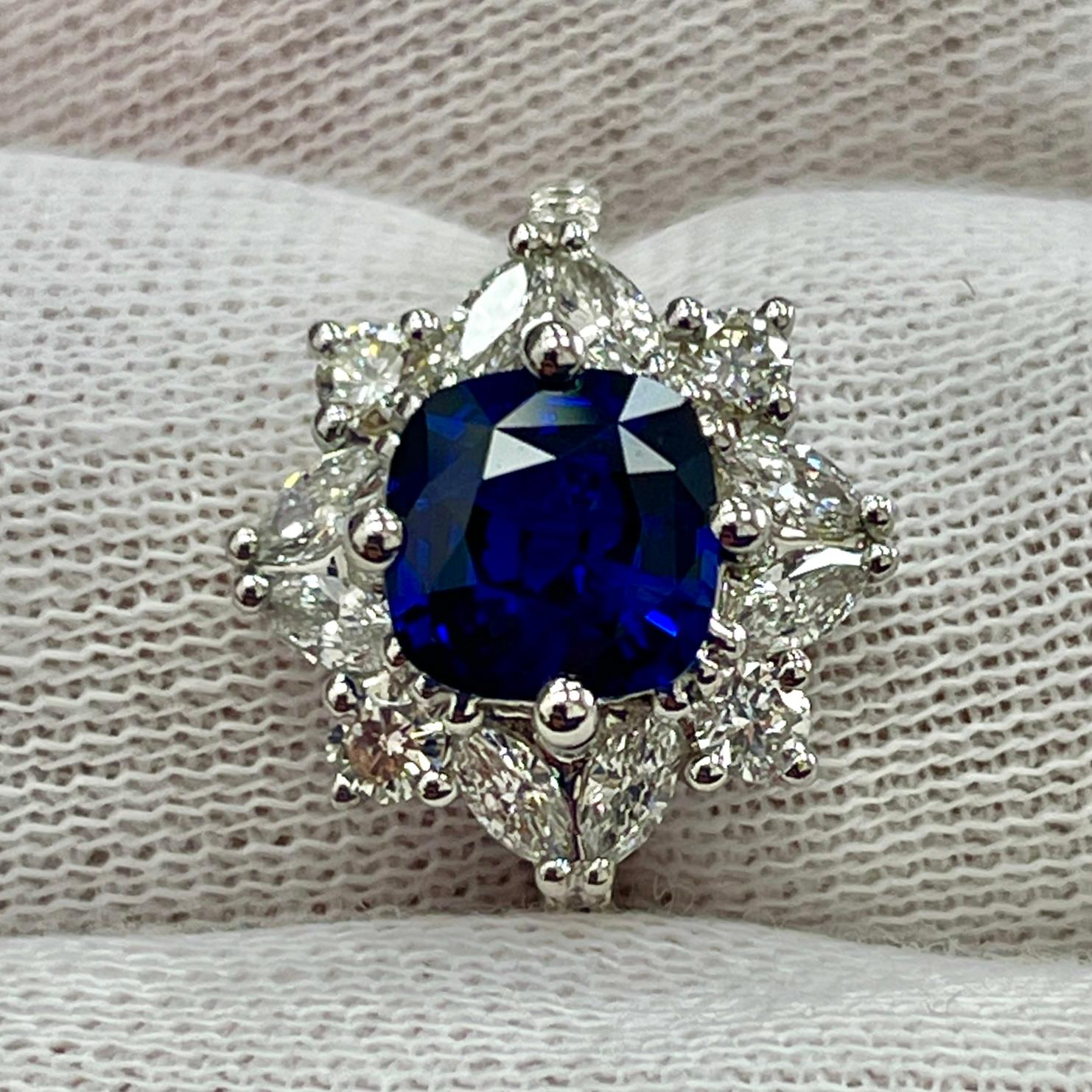 This is a STUNNING sapphire with a very deep color, mounted in an elegant 18K white gold and diamond ring with 0.67Ct of brilliant white diamonds. Suitable for any occasion!