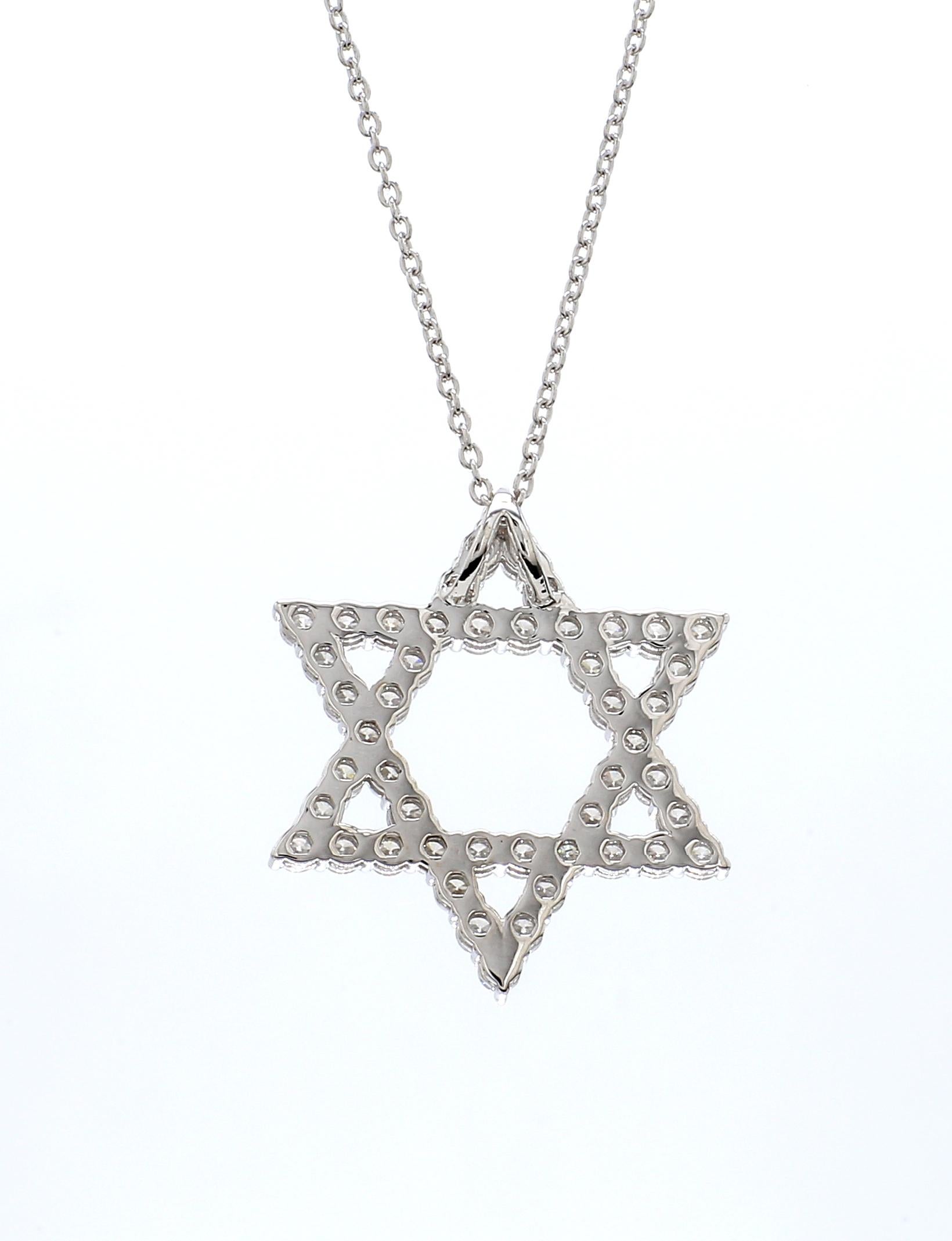 An elegant expression of timeless sophistication, this exquisite pendant necklace features a brilliant Star of David Shape  framed by a delicate halo of round brilliant diamonds, all masterfully set in polished 18K white gold. The graceful teardrop