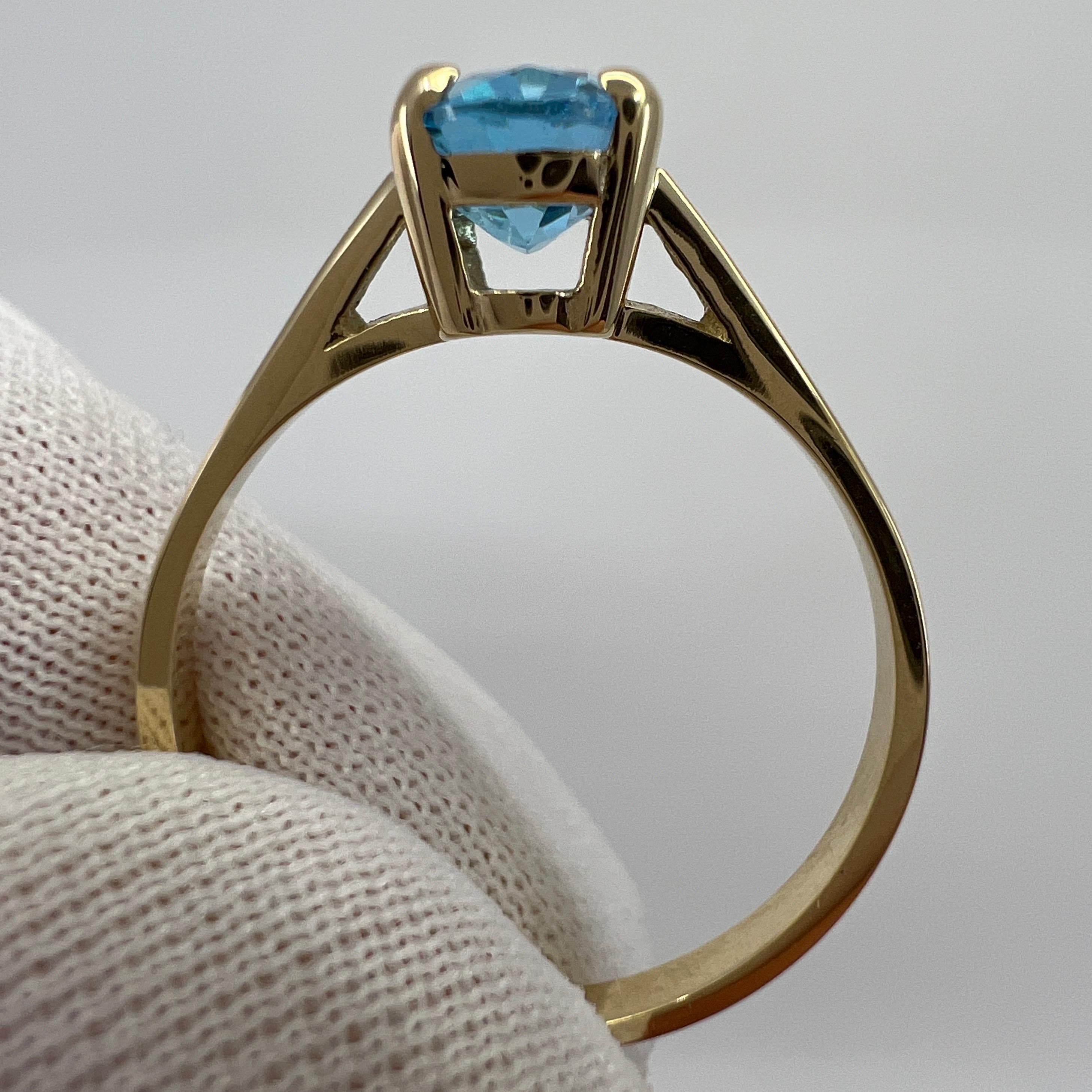 Women's or Men's 1.50 Carat Swiss Blue Topaz Oval Cut Yellow Gold Solitaire Ring For Sale