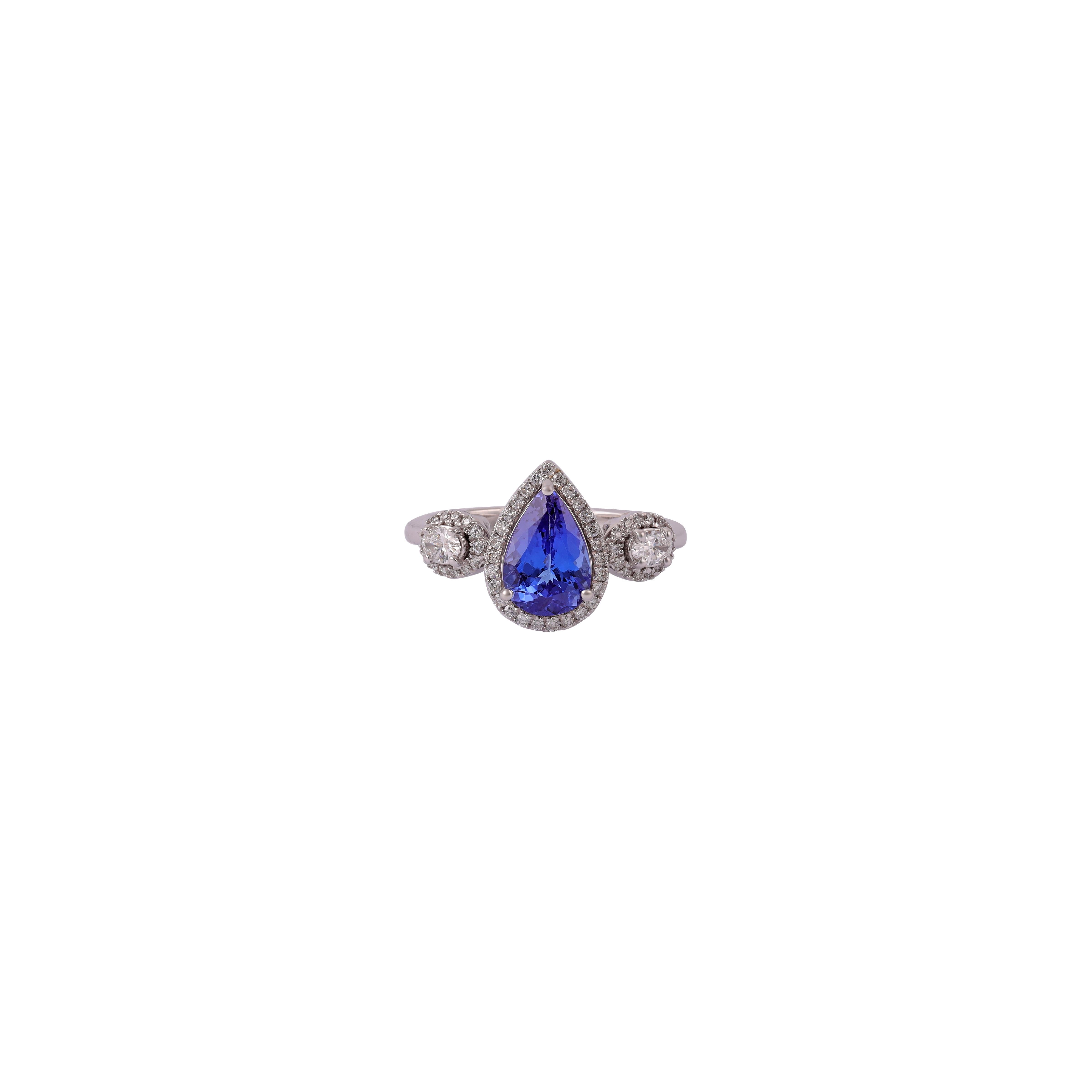 Exclusive tanzanite & diamond ring studded in 18k white gold
1 Radiant Tanzanite in 1.50 CTS
Diamond  0.32 CTS
18 k White gold 2.96 GMS

Custom Services
Resizing is available.