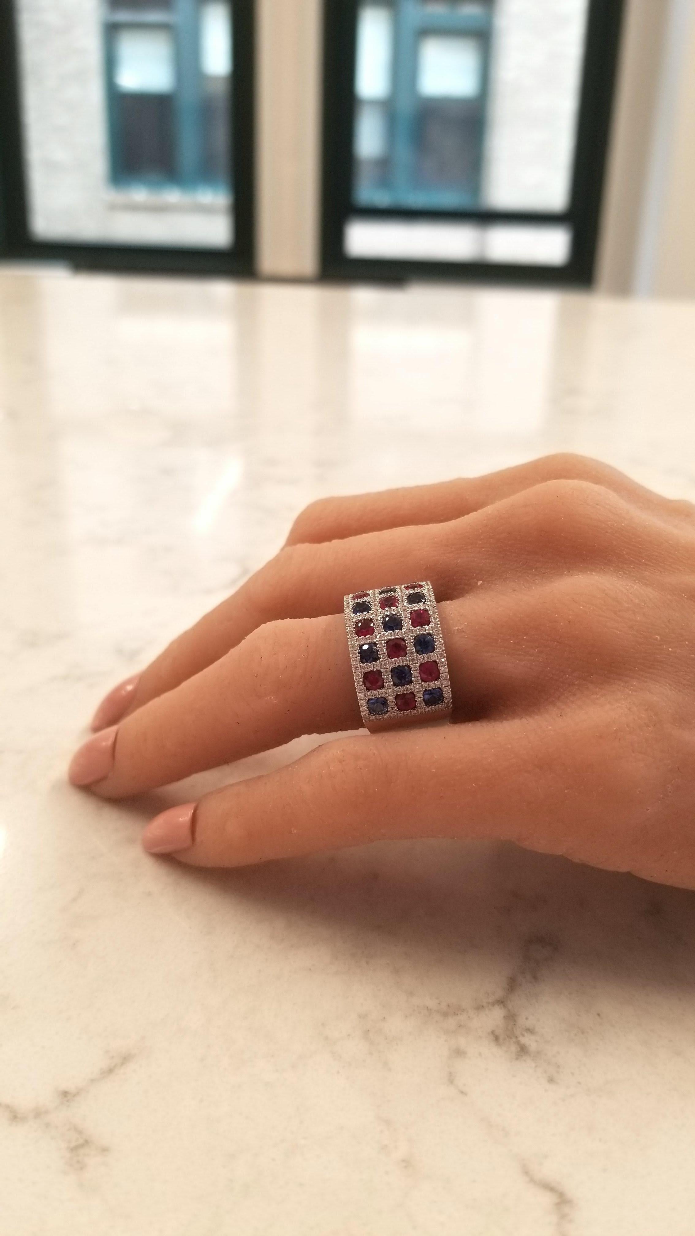 This checkerboard fashion ring is filled with luxury! Round cut sapphires totaling 1.50 carats and 1.40 carats of round cut rubies adorn this stunning band alternating in rich pops of color throughout. A total of 188 glittering round brilliant cut