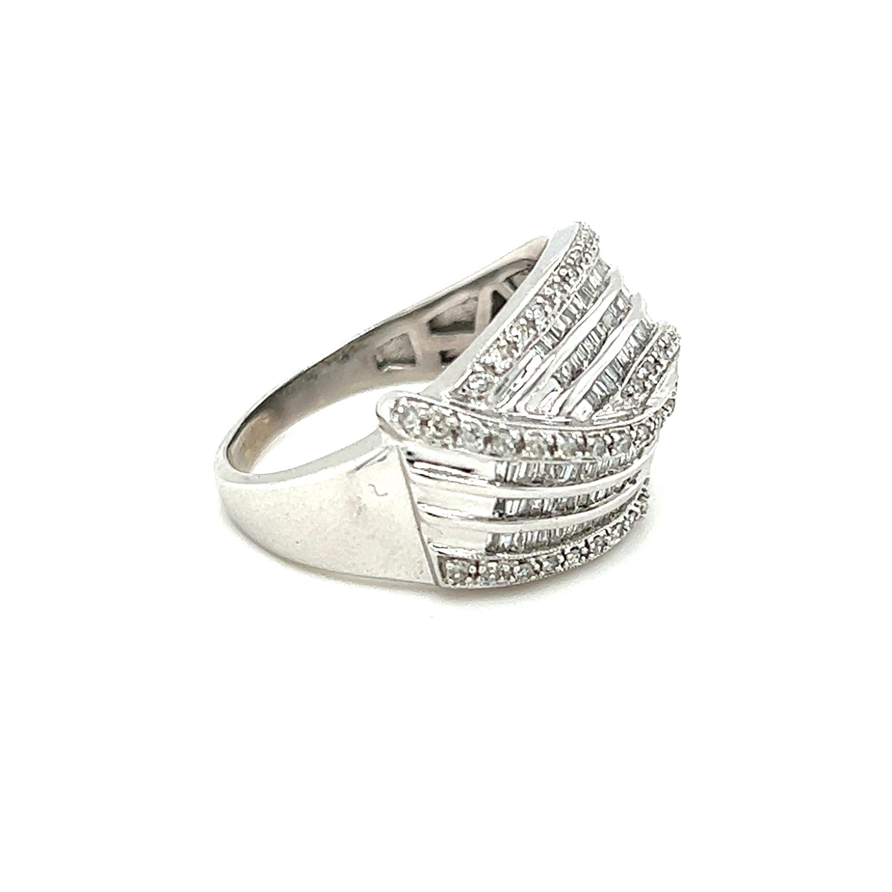 One diamond fashion ring, set with one hundred eight baguette-shaped diamonds, and fifty-five (55) round brilliant cut diamonds, approximately 1.50-carat total weight with matching I/J color and I1 clarity. The ring measures 15.45mm at the top of