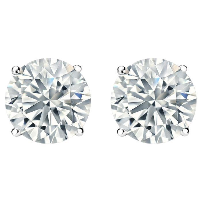 Clous d'oreilles en or blanc 14 carats avec diamants d'un poids total de 1,50 carat