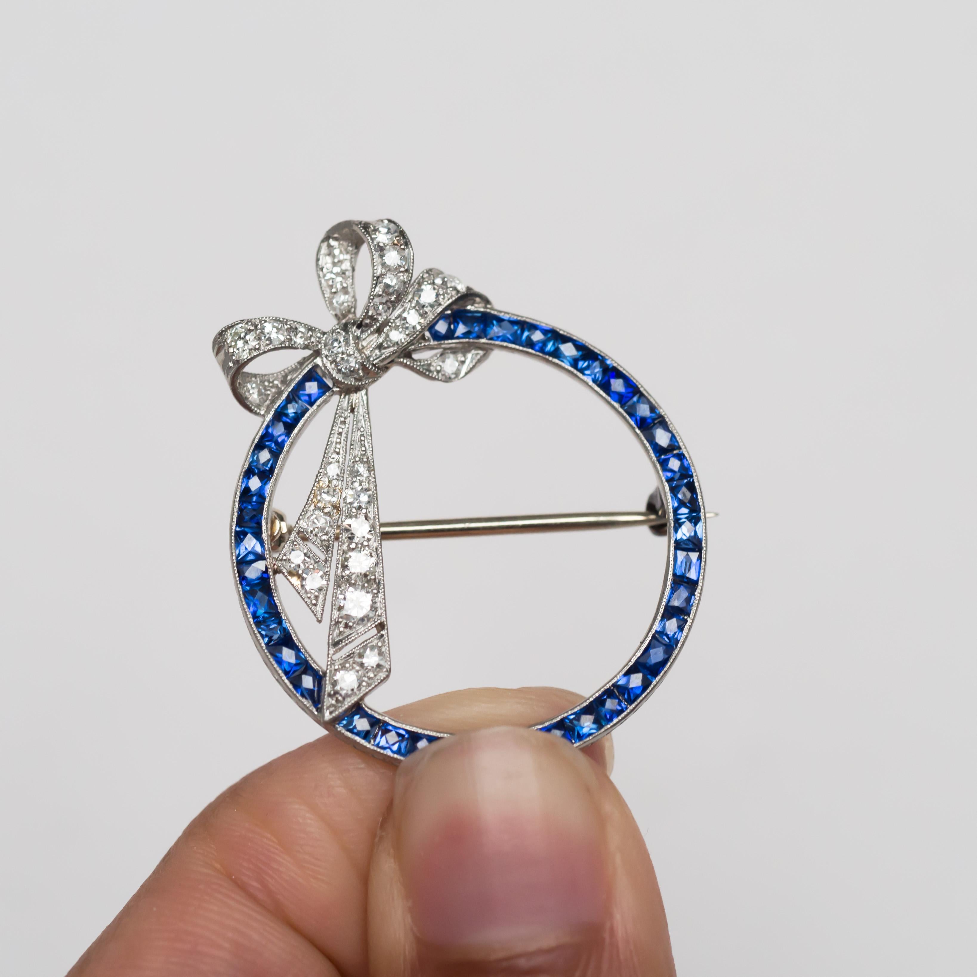 Metal Type: Platinum  [Hallmarked, and Tested]
Weight: 5.3 grams

Sapphire Details:
Weight: 1.50 carat, total weight
Cut: French Cut
Color: Blue
Clarity: VS


Diamond Details:
Weight: .40 carat, total weight
Cut: Old Single cut
Color: E-F
Clarity: