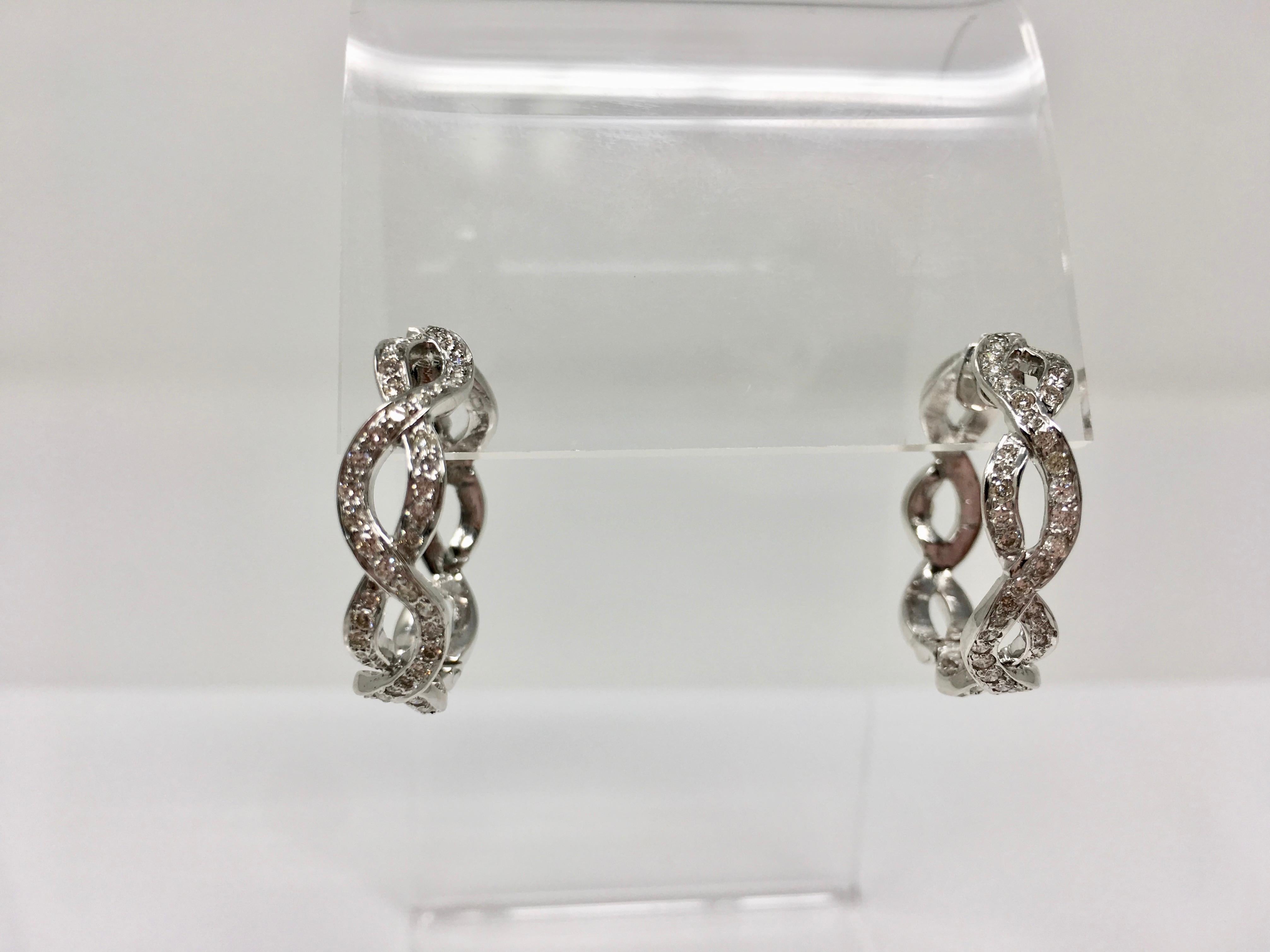 These diamond hoop earrings are beautifully handmade and feature white small round brilliant diamonds weighing 1.50 carat with VS clarity and GH color. These are great for everyday wear. 
