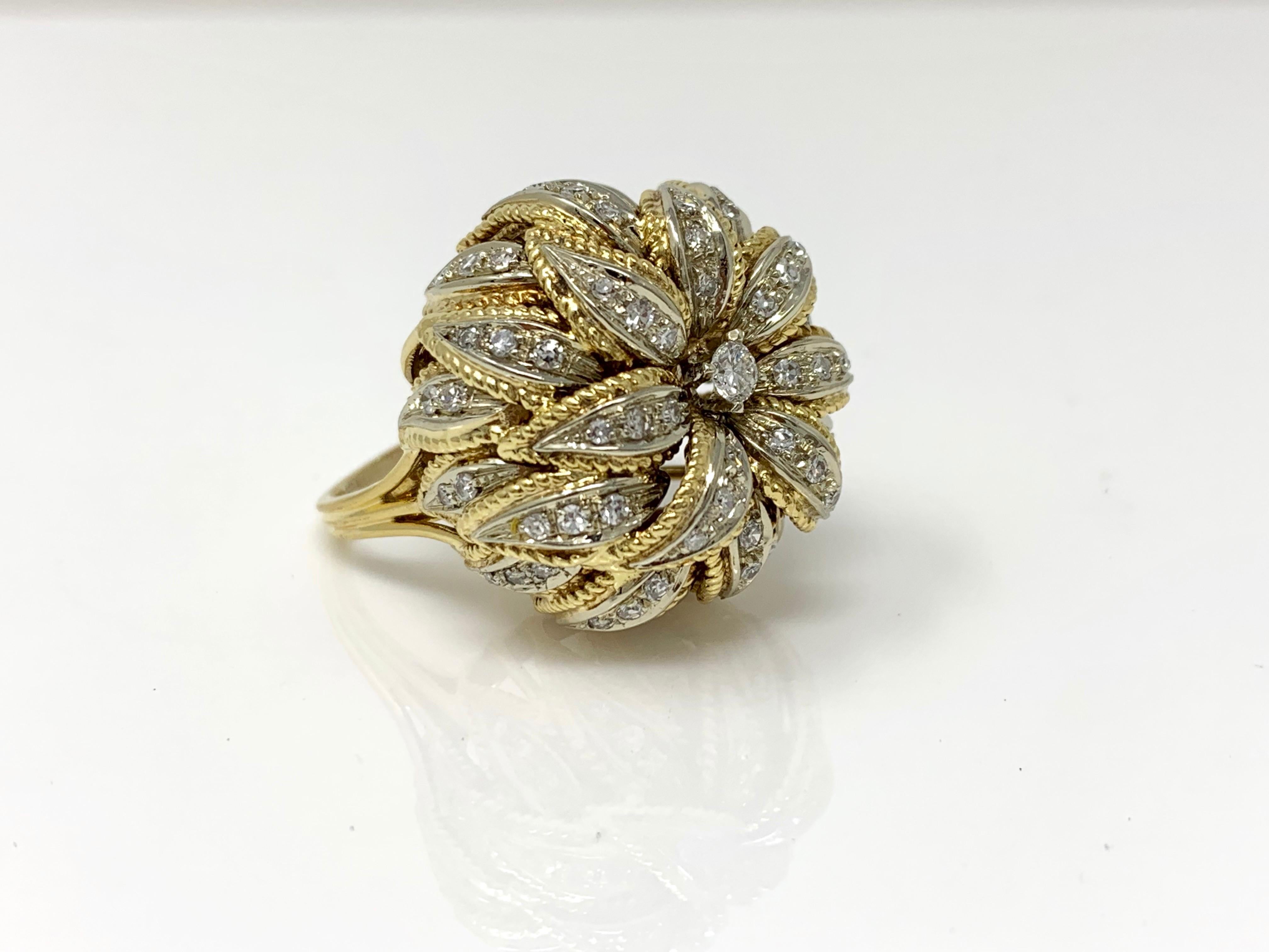 Looking for a unique diamond statement ring with a big look? Look no further. This stunning ring features white round brilliant diamond weighing 1.50 carat with HI color and VS clarity. It is hand crafted in 18k gold. 
