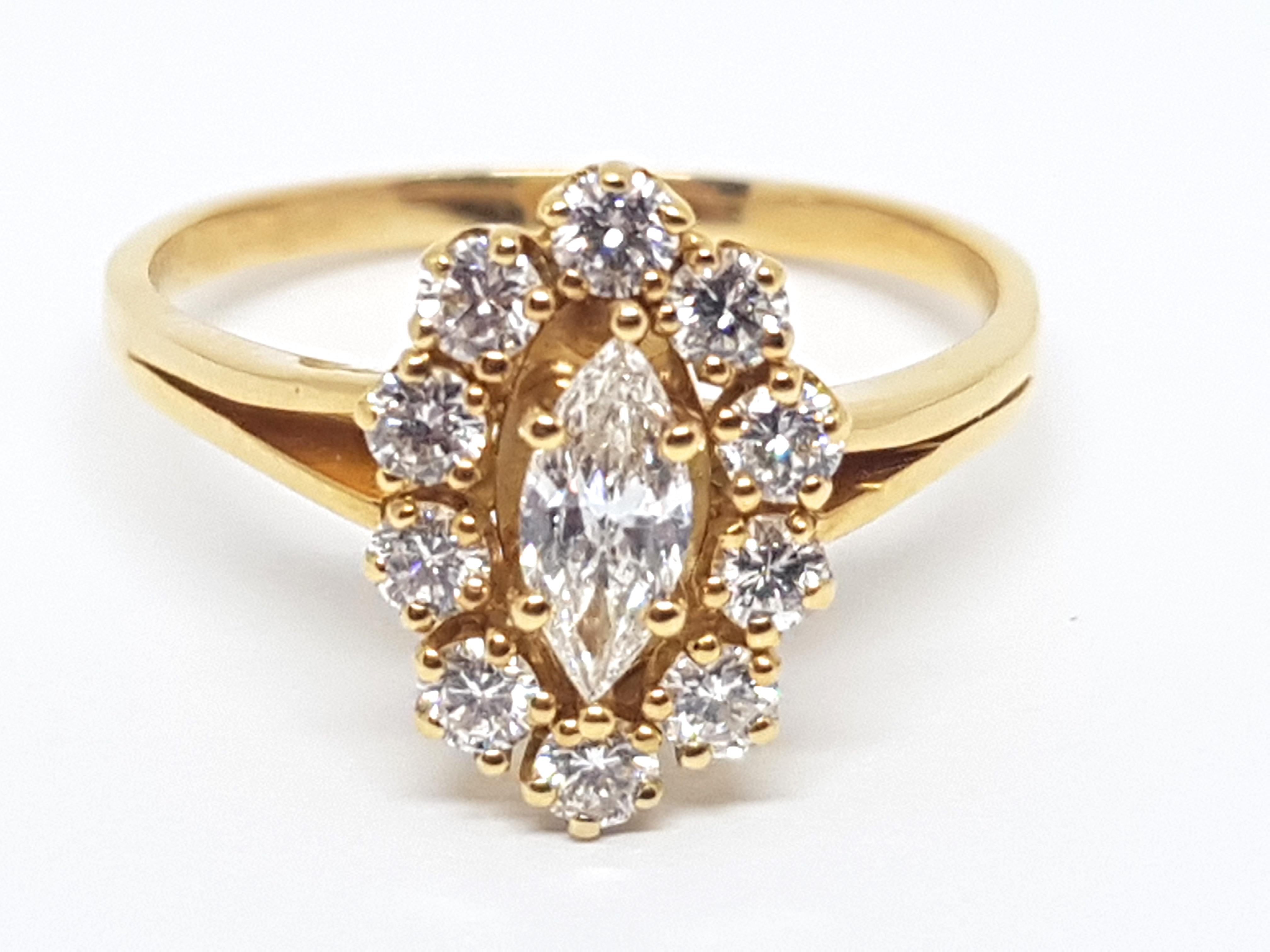 Gold: 18 carat yellow gold 
Weight: 3.71 gr. 
Center Diamond: 0.60 ct. colour: F clarity: VS cut: Marquise 
Diamonds: 0.90 ct. colour: F clarity: VS 
Width: 1.40 cm. 
Ring size: 58 / 18.50 / US 8.25
free adjustment of ring up to size 70 / 22.50mm /