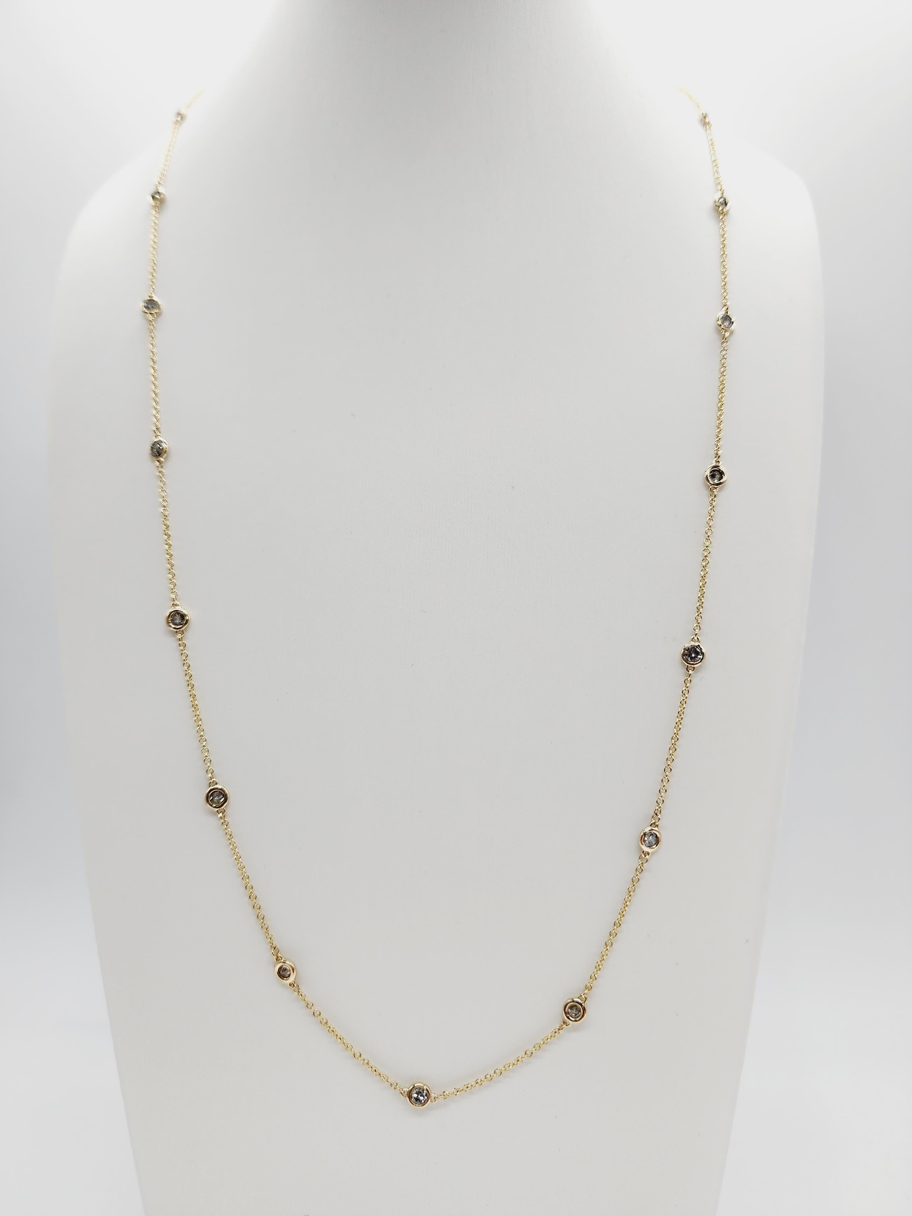 19 Stations Diamond by the yard necklace set in Italian made 14K yellow gold. The total weight is 1.50 carats. Beautiful shiny stones. The total length is 24 inch. Average I-SI.