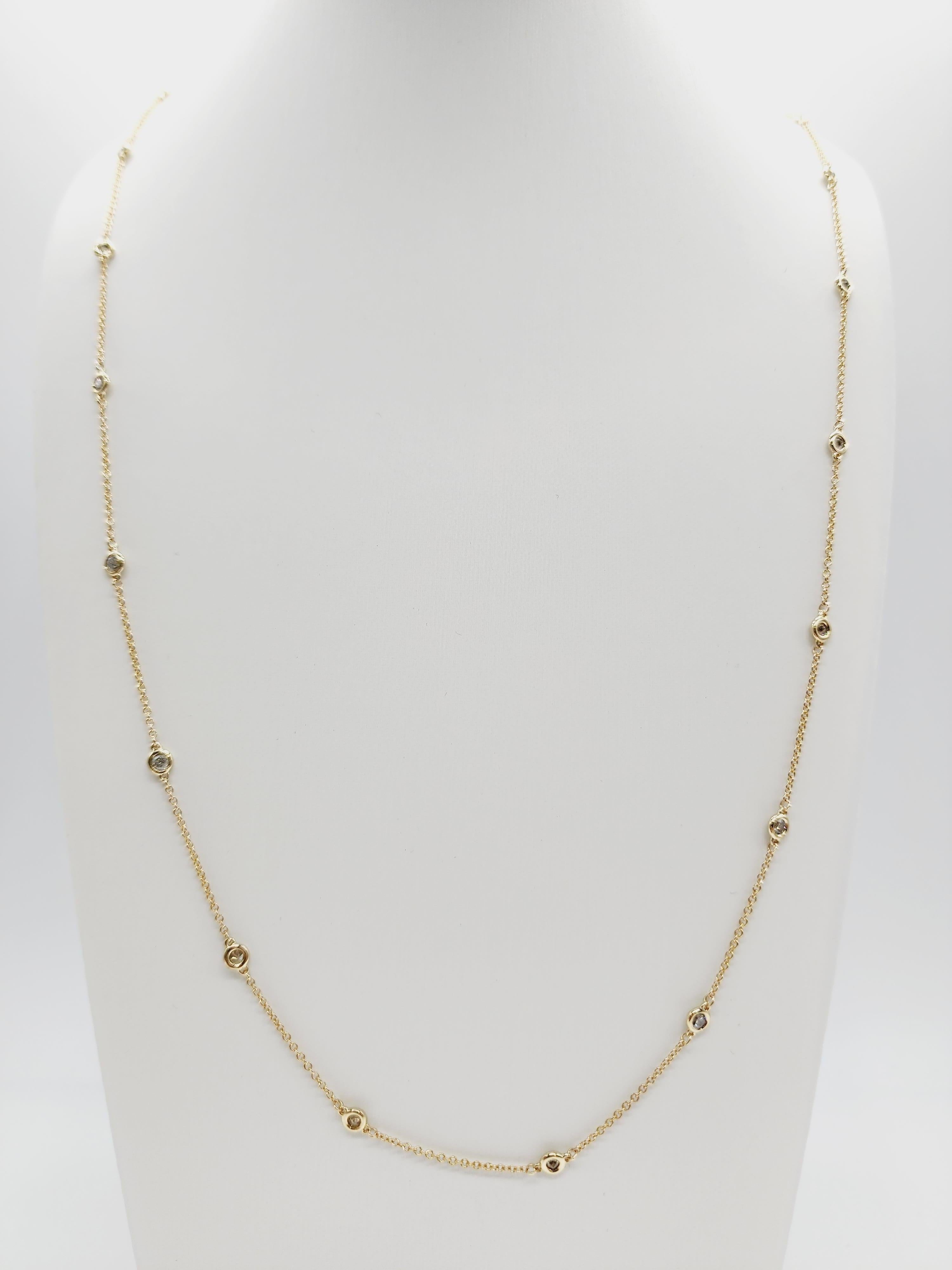 27 Stations Diamond by the yard necklace set in Italian made 14K yellow gold. The total weight is 1.50 carats. Beautiful shiny stones. The total length is 32 inch. Average I-SI.