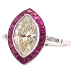 1.50 carats L/Vs2 marquise diamond and ruby ring