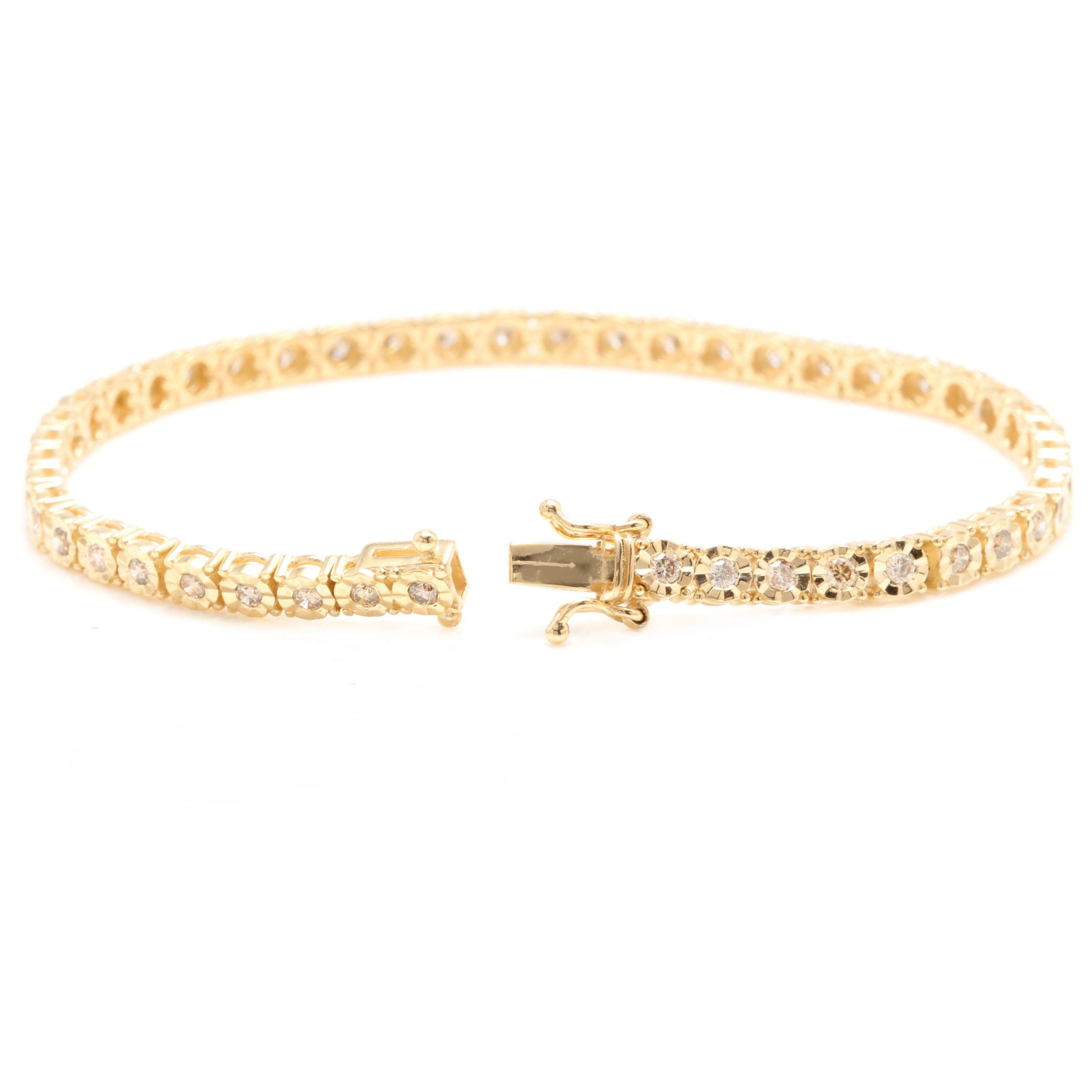 Very Impressive 1.50 Carats Natural Diamond 14K Solid Yellow Gold Tennis Bracelet

STAMPED: 14K

Total Natural Round Diamonds Weight: Approx. 1.50 Carats (46pcs.) (color J-K / Clarity SI1-SI2)

Bracelet Length is:  7 inches

Width: 3.75mm

Bracelet