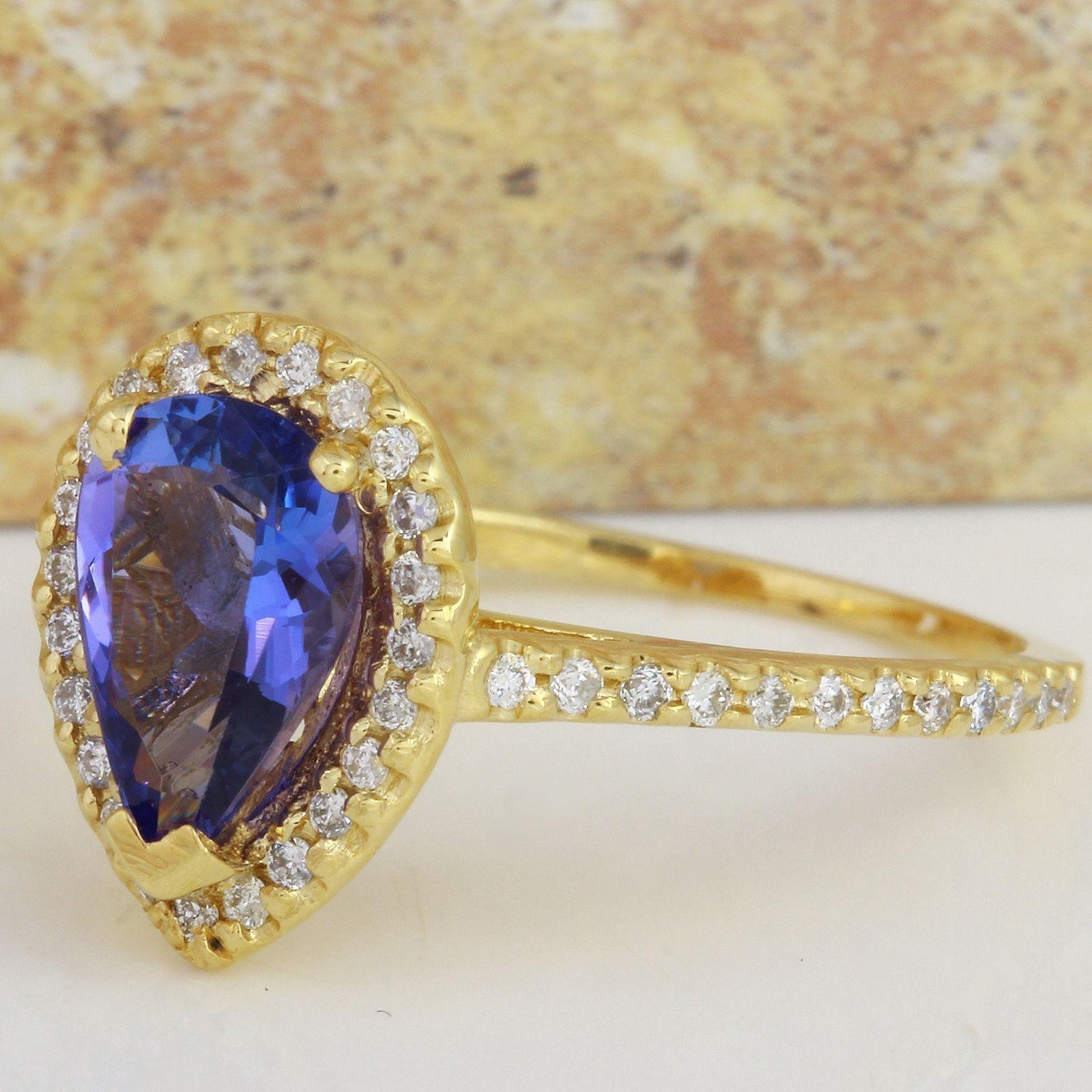 1.50 Carats Natural Very Nice Looking Tanzanite and Diamond 14K Solid Yellow Gold Ring

Total Natural Pear Cut Tanzanite Weight is: Approx. 1.10 Carats

Tanzanite Treatment: Heat

Natural Round Diamonds Weight: Approx. 0.40 Carats (color G-H /