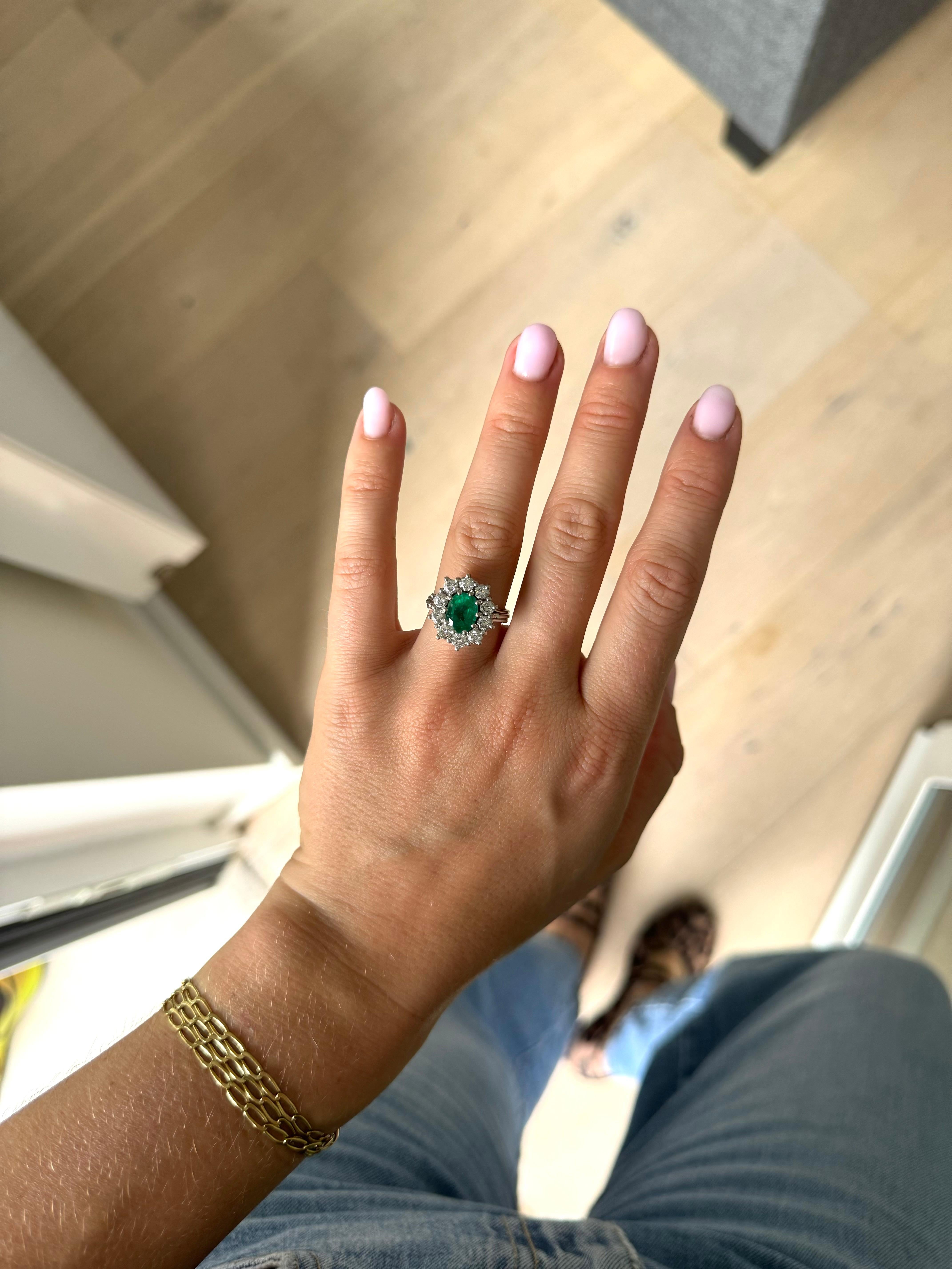 Oval Cut 1.50 Carats oval Emerald and diamond cluster ring For Sale