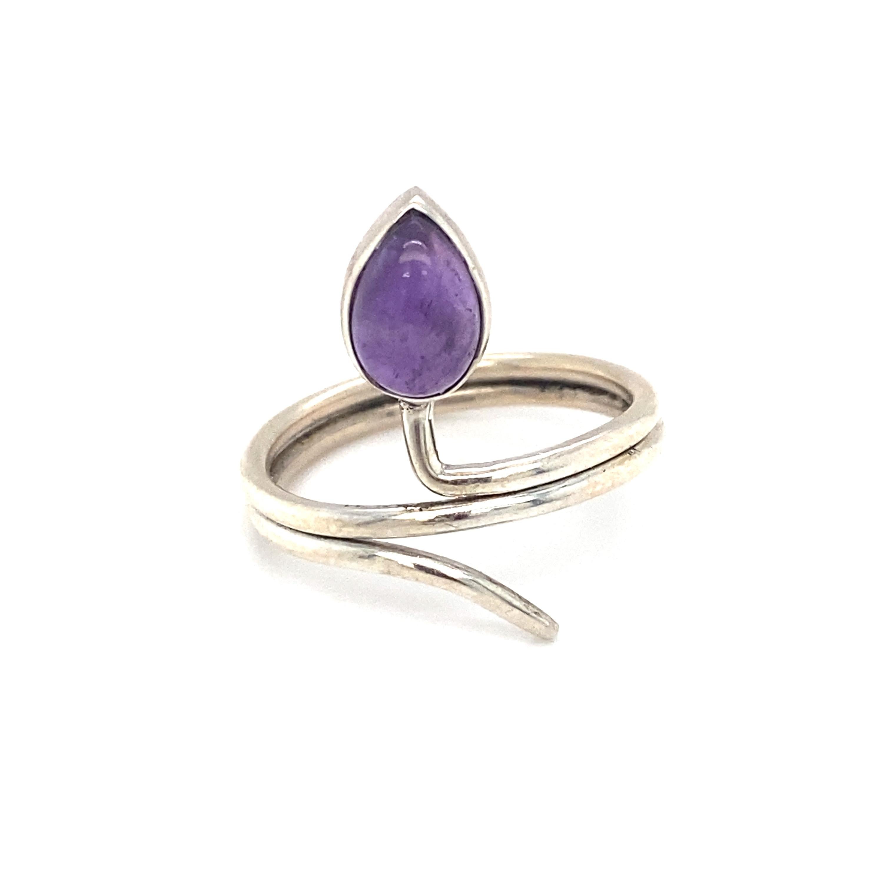 
Item Details: This slightly adjustable serpent ring has one pear cut cabochon amethyst stone.

Circa: 21st Century
Metal Type: Sterling Silver
Weight: 3.6g
Size: US 9.5, slightly adjustable
