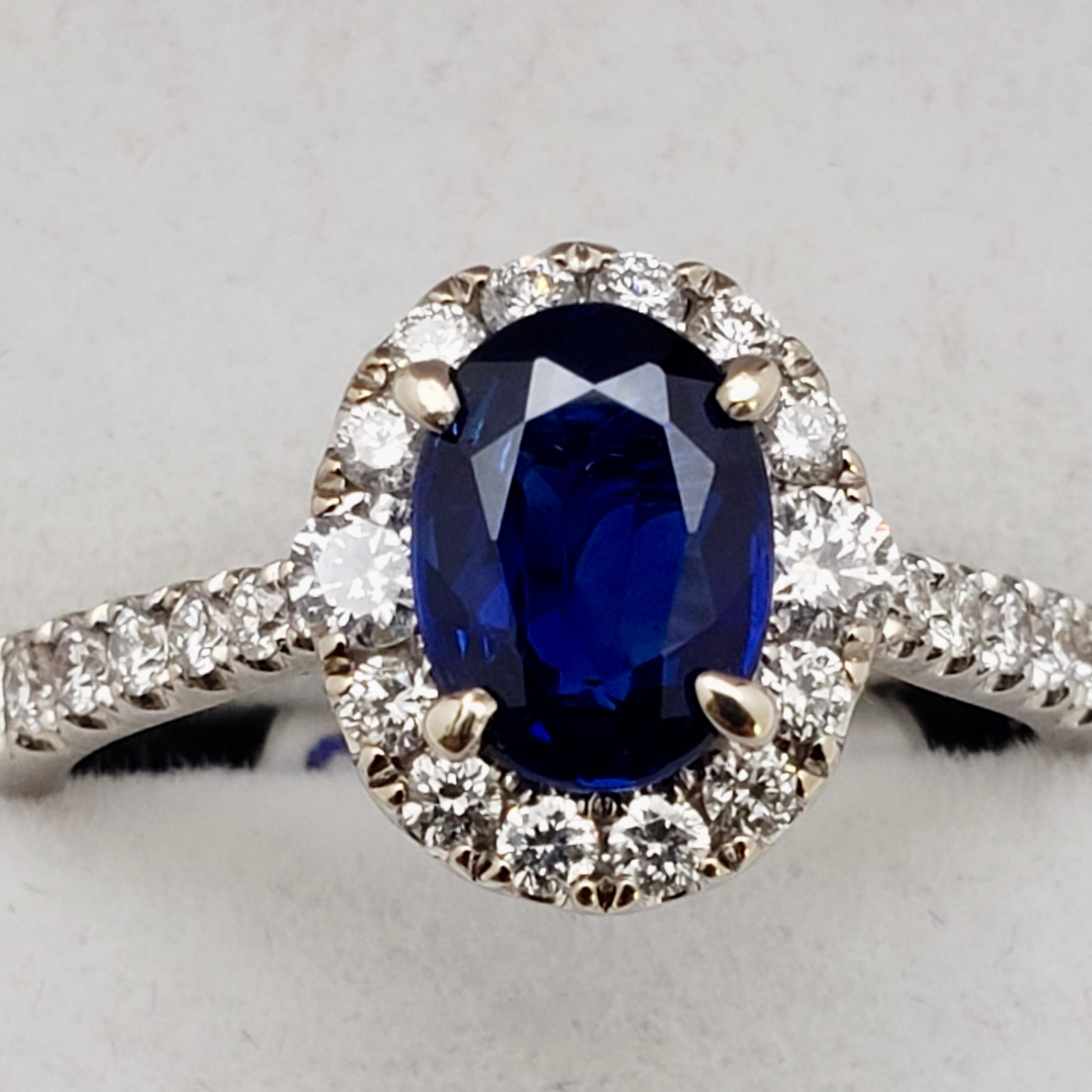 An original 18K white gold diamond and sapphire ring. Mounted with one GIA certified natural unheated oval shaped sapphire (natural corundum), report number: 2223878340. This sapphire measures 7.66 x 5.64 x 2.92 mm, and weighs approximately 1.50 CT.