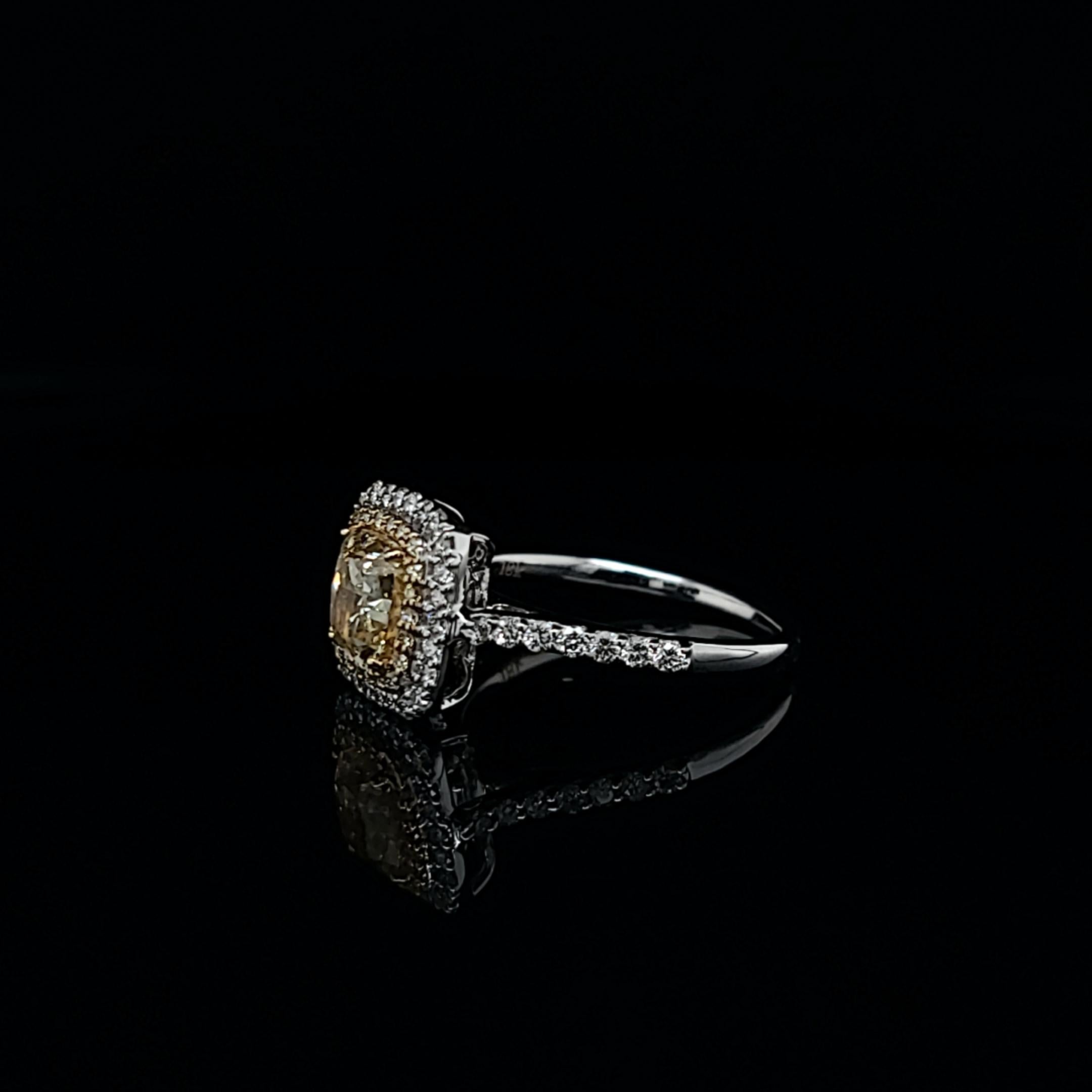 Ring featuring a 1.50 carat natural fancy light yellow cushion (SI1), GIA#: 7248913741. Accented by 22/.10ctw yellow melee and 38/.43ctw white melee. Set in 18k gold, size 6.5. 
