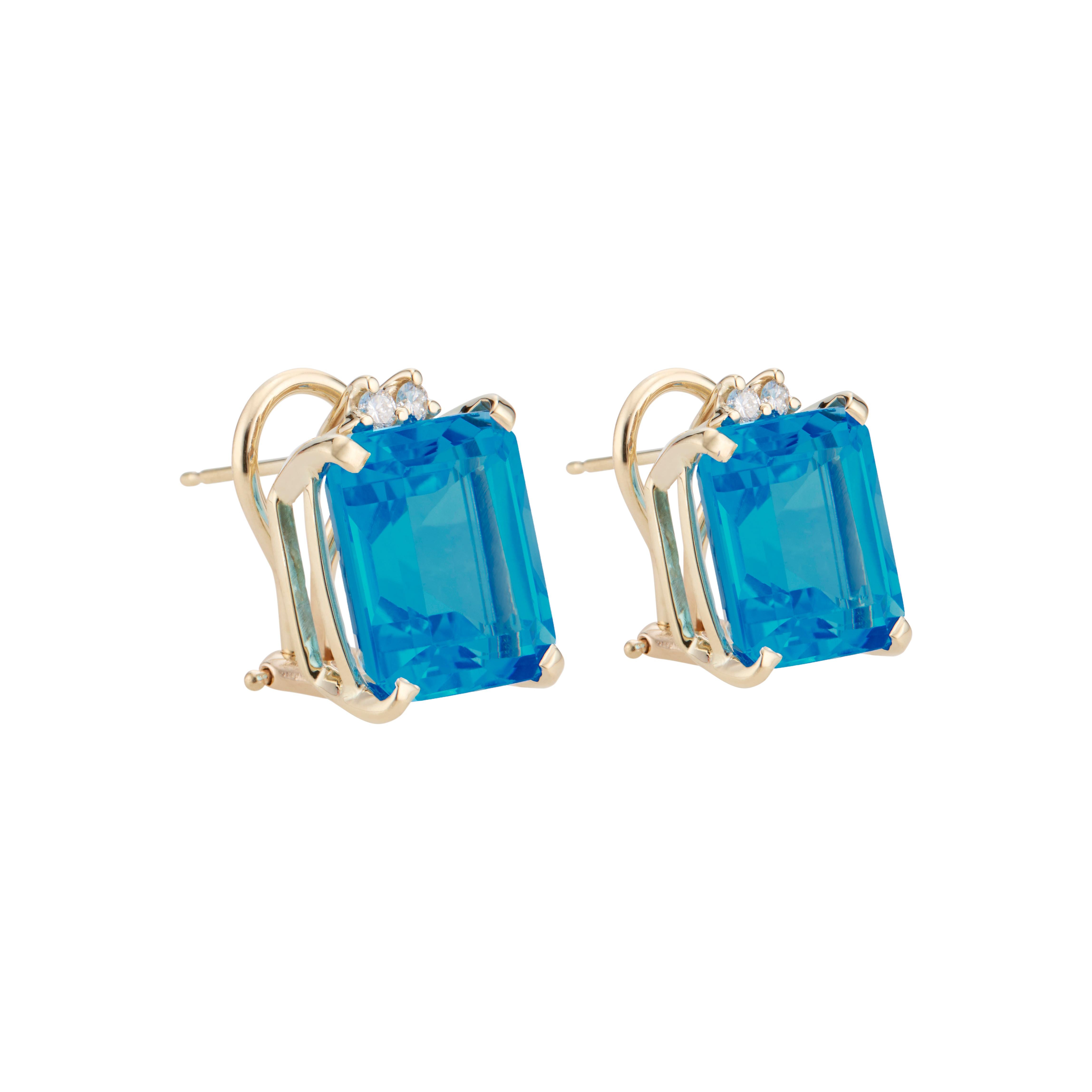 Topaz and diamond dangle earrings. 2 Bright emerald cut blue topaz set in custom made clip post 14k yellow gold settings with 4 round accent diamonds.  

2 rectangular cut blue topaz, approx. 15.005cts
4 round brilliant cut diamonds, G VS approx.