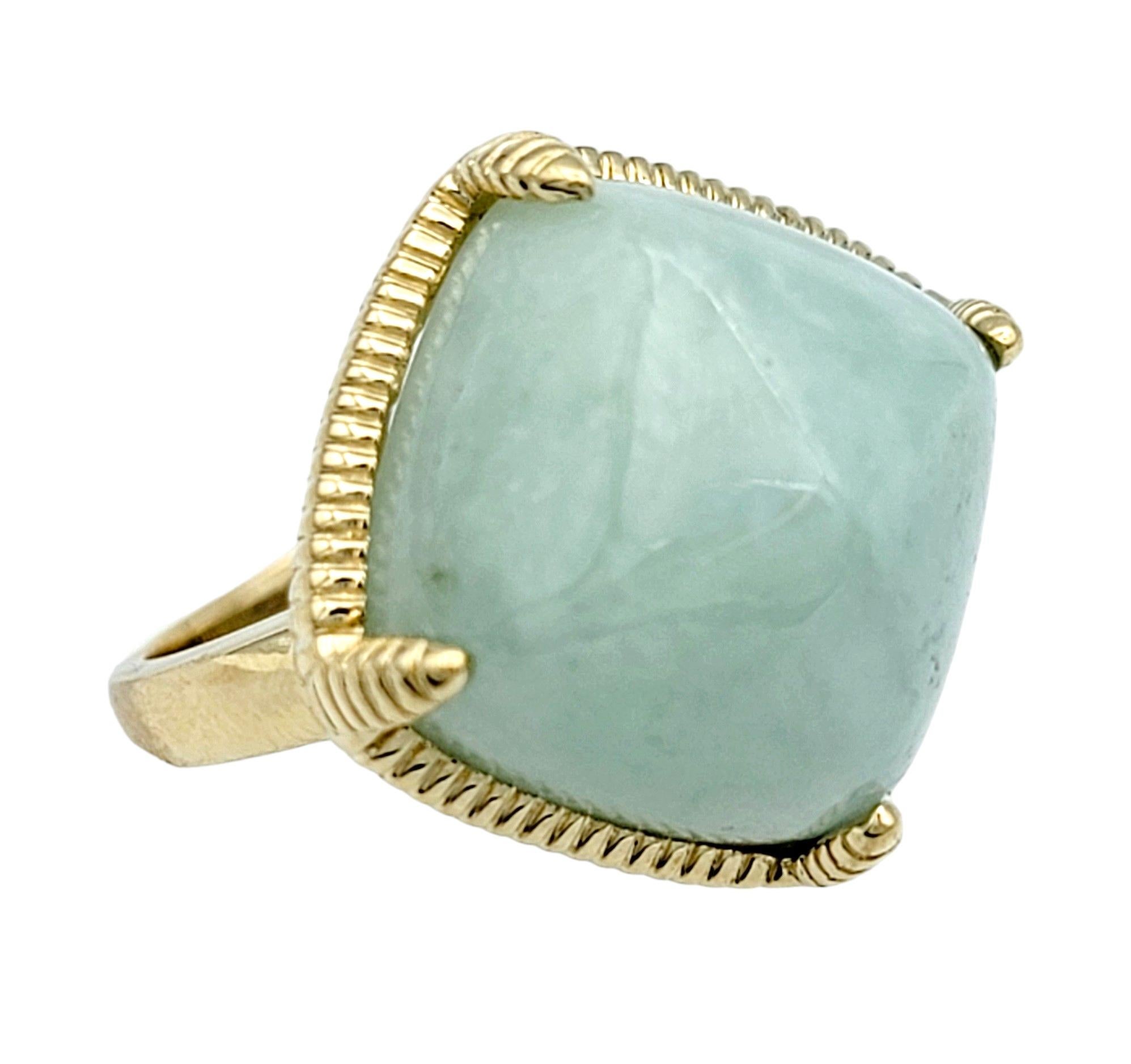 Ring Size: 7

This squared cabochon jade ring, set in a ridged 14 karat yellow gold setting, is a stunning blend of classic elegance and natural beauty. The squared shape of the cabochon jade creates a unique focal point, drawing the eye with its