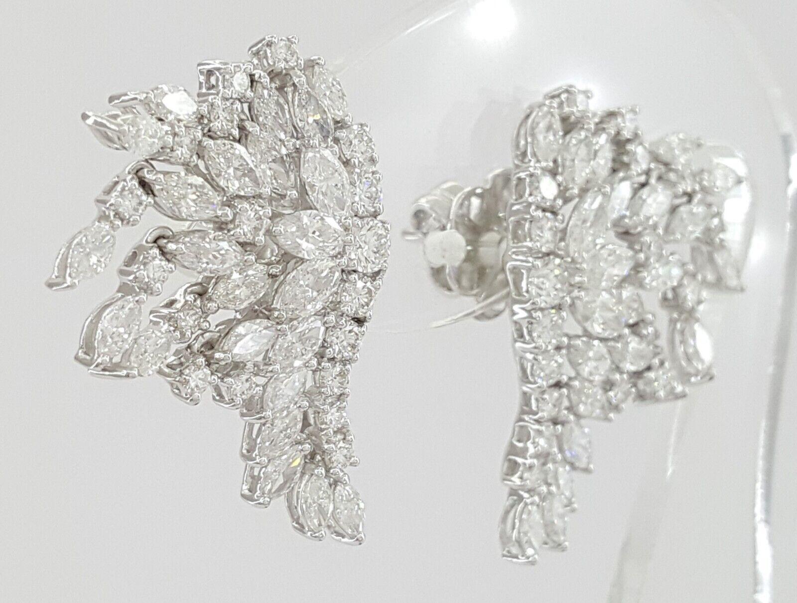 4.6 ct 18K White Gold Marquise & Round Diamond Angel Wings drop Dangle Earrings. 


Earrings contain 36 Round Brilliant Cut White Diamonds weighing approximately 1.14 ct. The diamonds are E-G in color and VS1-SI1 clarity.


There are also 46