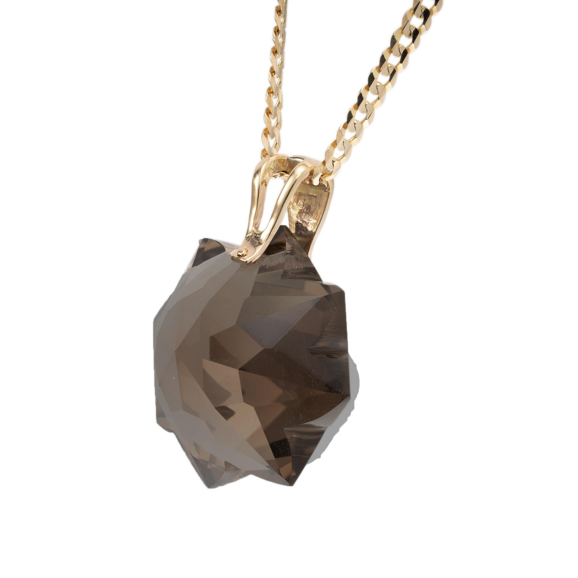 Vintage 1960's eight-pointed star cut 150.00 carat smoky quartz pendant on a 20 Inch yellow gold chain. 

1 star cut brown smoky quartz, VS approx. 150cts
14k yellow gold 
39.7 grams
Top to bottom: 46.9mm or 1 7/8 Inch
Width: 37.7mm or 1.5