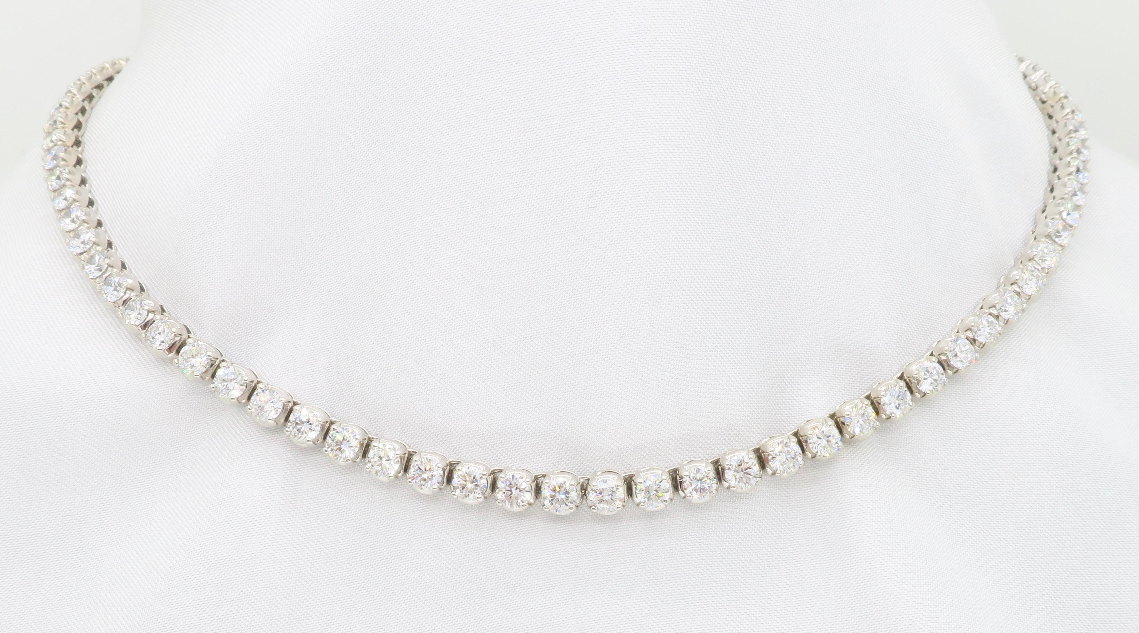 Absolutely stunning 14k white gold tennis necklace featuring approximately 15.00CTW of Round Brilliant Cut Diamonds.

Total Diamond Carat Weight:  Approximately 15.00CTW
Diamond Cut: LG Round Brilliant Cut  
Color: Average F
Clarity: Average