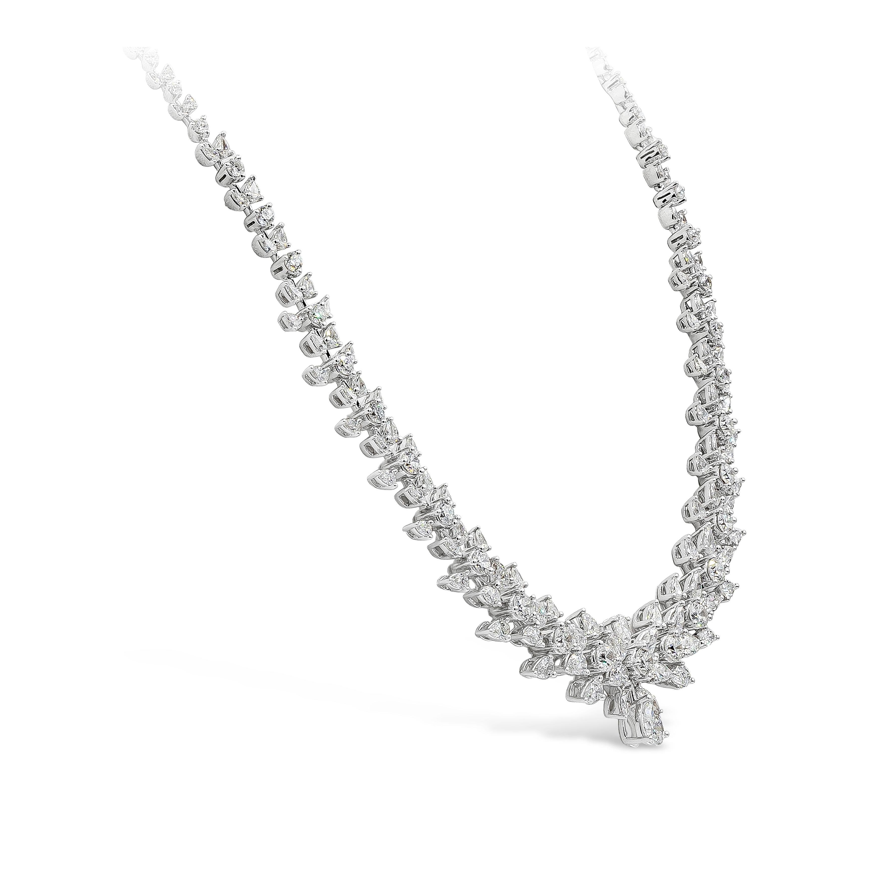 A gorgeous necklace set with 15.01 carats of brilliant round, marquise, and pear shape diamonds in an incredible design. The size of the diamonds graduate larger as it elegantly drops down the neck. Set in 18k white gold and 17.75 inches in length.