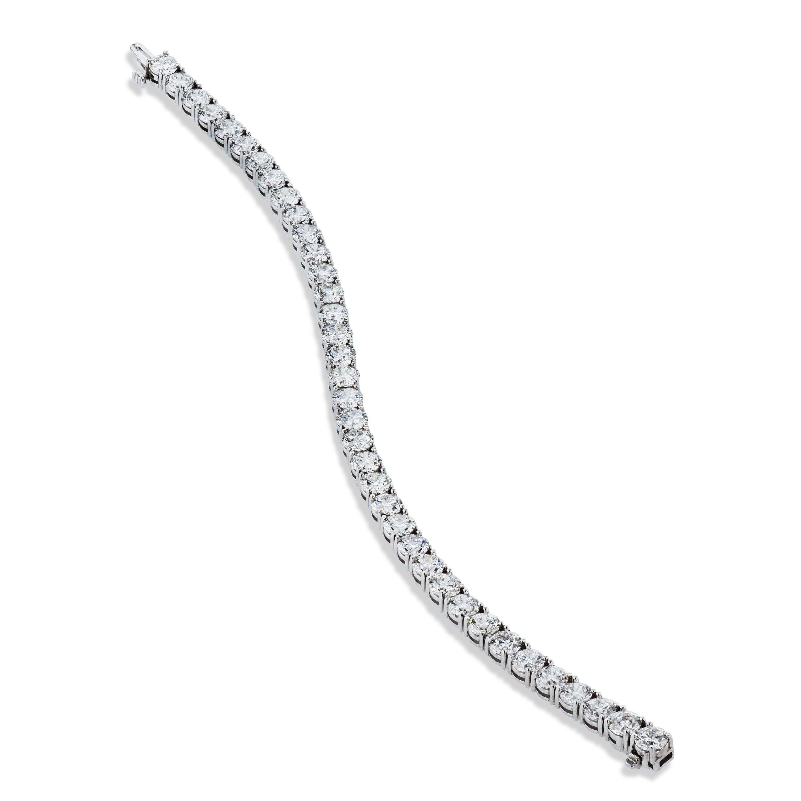 This handmade H&H Collection tennis bracelet is composed of 37 diamonds with a total carat weight of 15.01. This magnificent 7