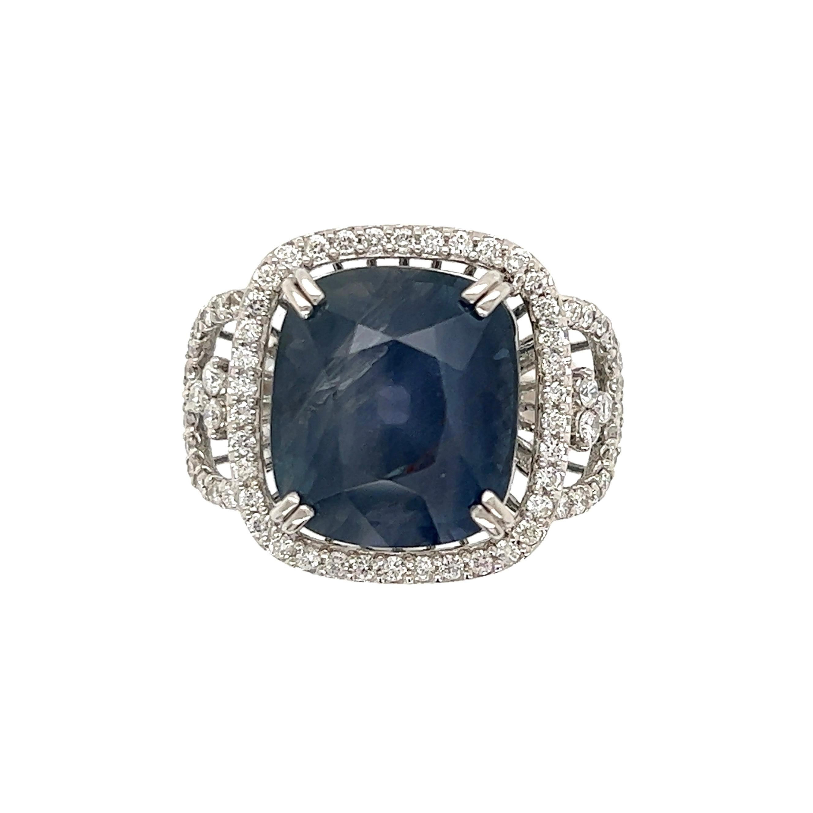 Simply Beautiful, Elegant and finely detailed Art Deco Revival Cushion-Cut Sapphire and Diamond Platinum Cocktail Ring. Center securely nestled with a 15.08 Carat Cushion Sapphire surrounded by Diamonds weighing approx. 0.66tcw and enhancing the