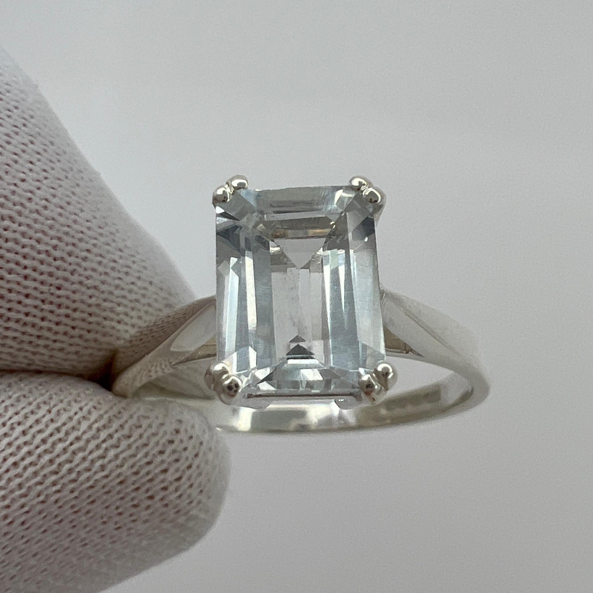 Light Blue Emerald Cut Aquamarine Solitaire Sterling Silver  Ring.

1.50 Carat aquamarine with a stunning bright blue colour and good clarity, some small natural inclusions visible (as shown in photos) but not a dirty stone. 

Also has an excellent