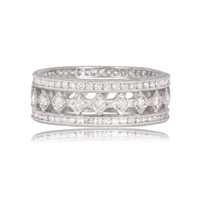 A stunning harlequin collection platinum and diamond eternity band featuring round diamonds in a mesmerizing harlequin design. The band showcases a center row of full-cut diamonds set in diamond-shaped boxes, bordered by fine-quality full-cut