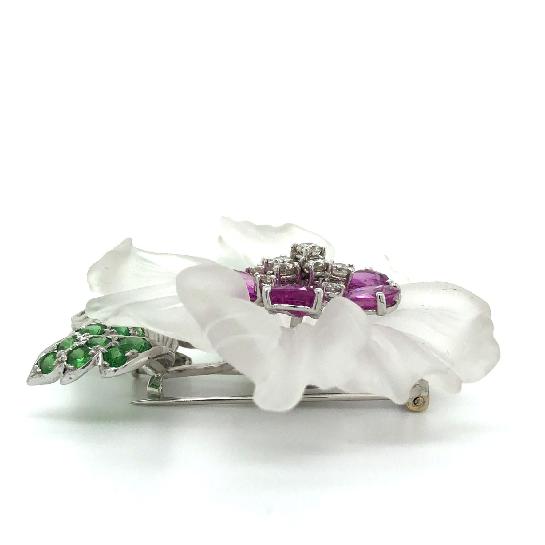 Incredibly detailed flower brooch with 1.50cts diamonds, G color, VS2 clarity, 5.66ct pink spinels and 3.47ct green spinels set in 18K white gold. Such an exquisite piece to add to your collection. You can also attach it to a chain and wear it as a