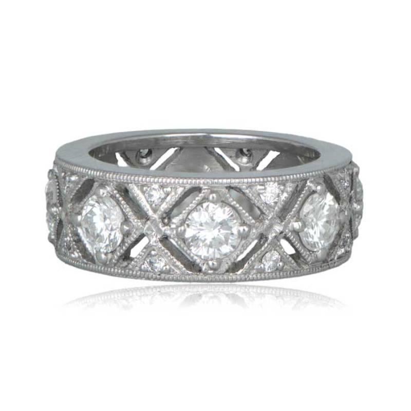 This elegant Edwardian-style wedding band is a masterpiece of platinum craftsmanship, embellished with dazzling diamonds.

Each larger diamond is complemented by two smaller diamonds above and below, creating a captivating arrangement. Delicate