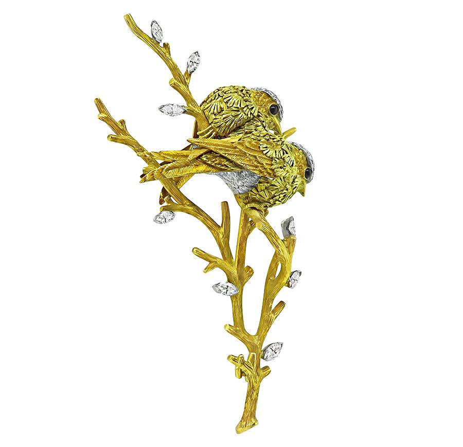 This is an amazing 18k yellow and white gold and platinum bird pin. The pin is set with sparkling marquise and round cut diamonds that weigh approximately 1.50ct. The color of these diamonds is F-G with VS clarity. The diamonds are accentuated by