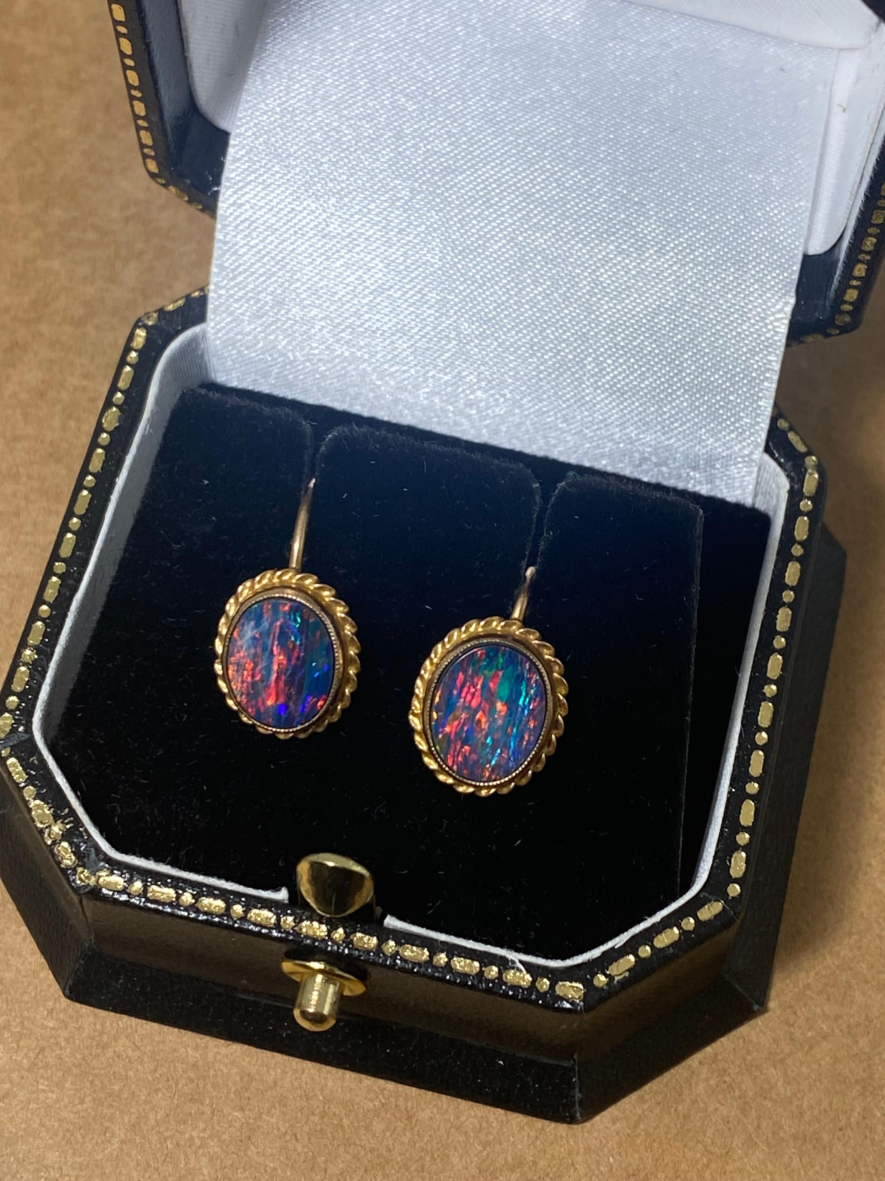 Handmade in 10K yellow gold, 
these clip on earrings are retro, 
yet in immaculate condition

Each bezel set with  
a 1.50ct Boulder Opal from Winton, 
(8mm x 9.5mm approx.)
of oval shape & top quality, 
displaying the most unique myriad of colours