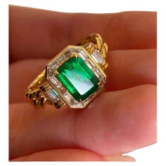 Bague en or massif 18k avec émeraude de 1,50ct et diamant de 0,50ct