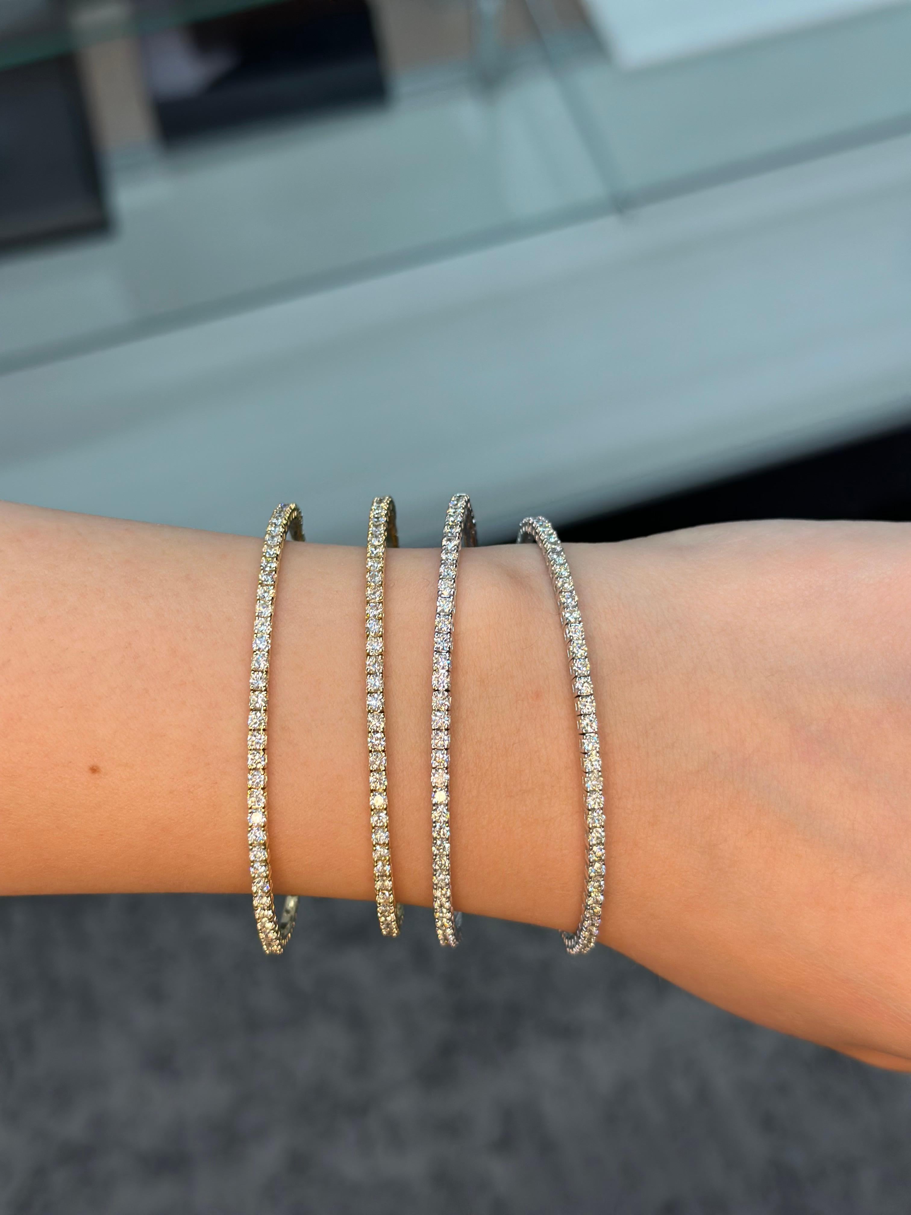This Diamond Bangle is an amazing and versatile piece. It's made of 14K White Gold for comfort and style. The stunning Diamonds catch the light and sparkle perfectly. The flexible design fits comfortably on your wrist. It's perfect to stack or pair