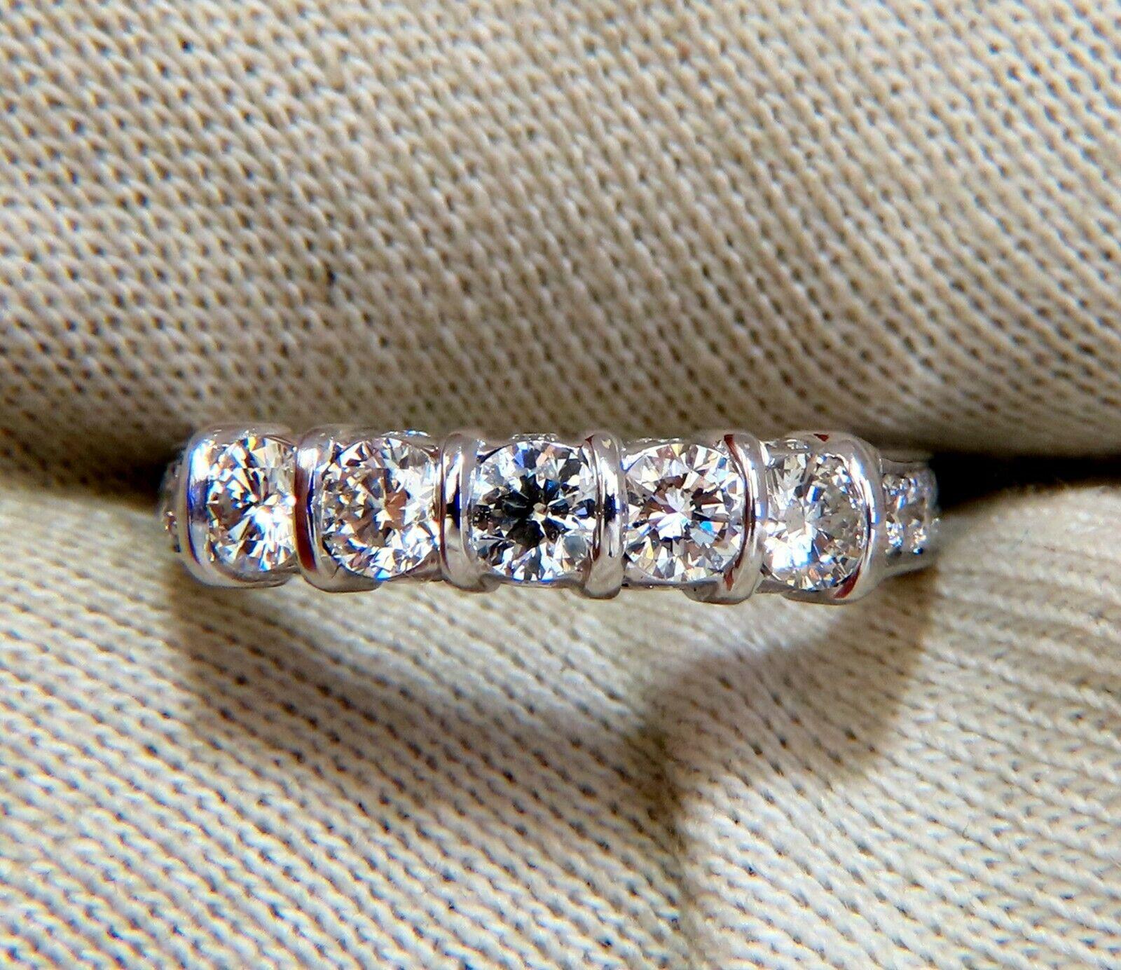 1.50 carat natural round diamonds band.

Five Stone channel set top & bead set pave on sides.

14 karat white gold 4 g

Ring is 4.6 mm wide,

3.6 mm depth

current size 7.75

$5,000 appraisal certificate will accompany