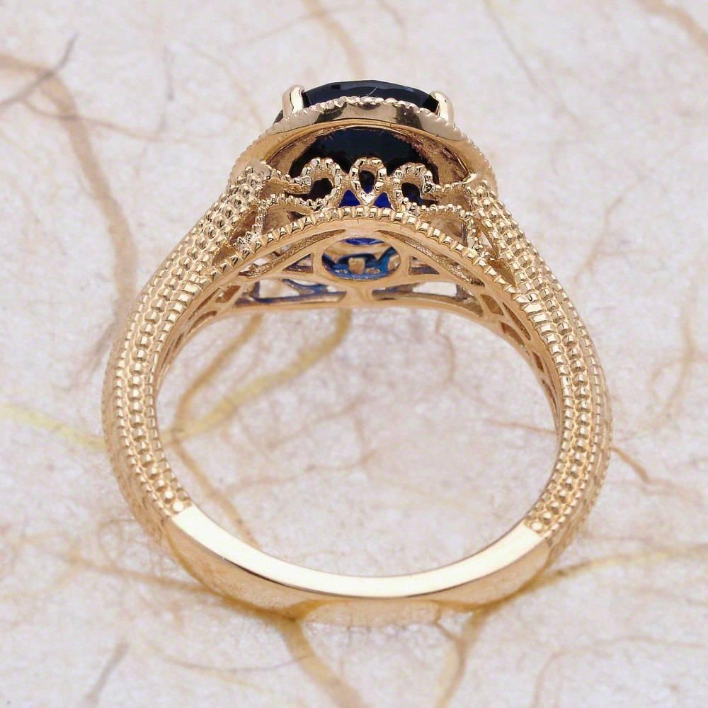 Art Nouveau 1.50 Carat Oval Cut Blue Sapphire Engagement Ring in 14 Karat Yellow Gold For Sale
