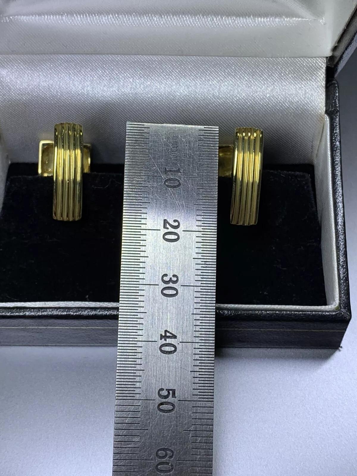 Add a touch of elegance to your outfit with these stunning cufflinks . Made with 18ct yellow gold, these chunky large cufflinks feature two natural blue sapphire gemstones, each with an excellent cut grade. The total carat weight of the ring is