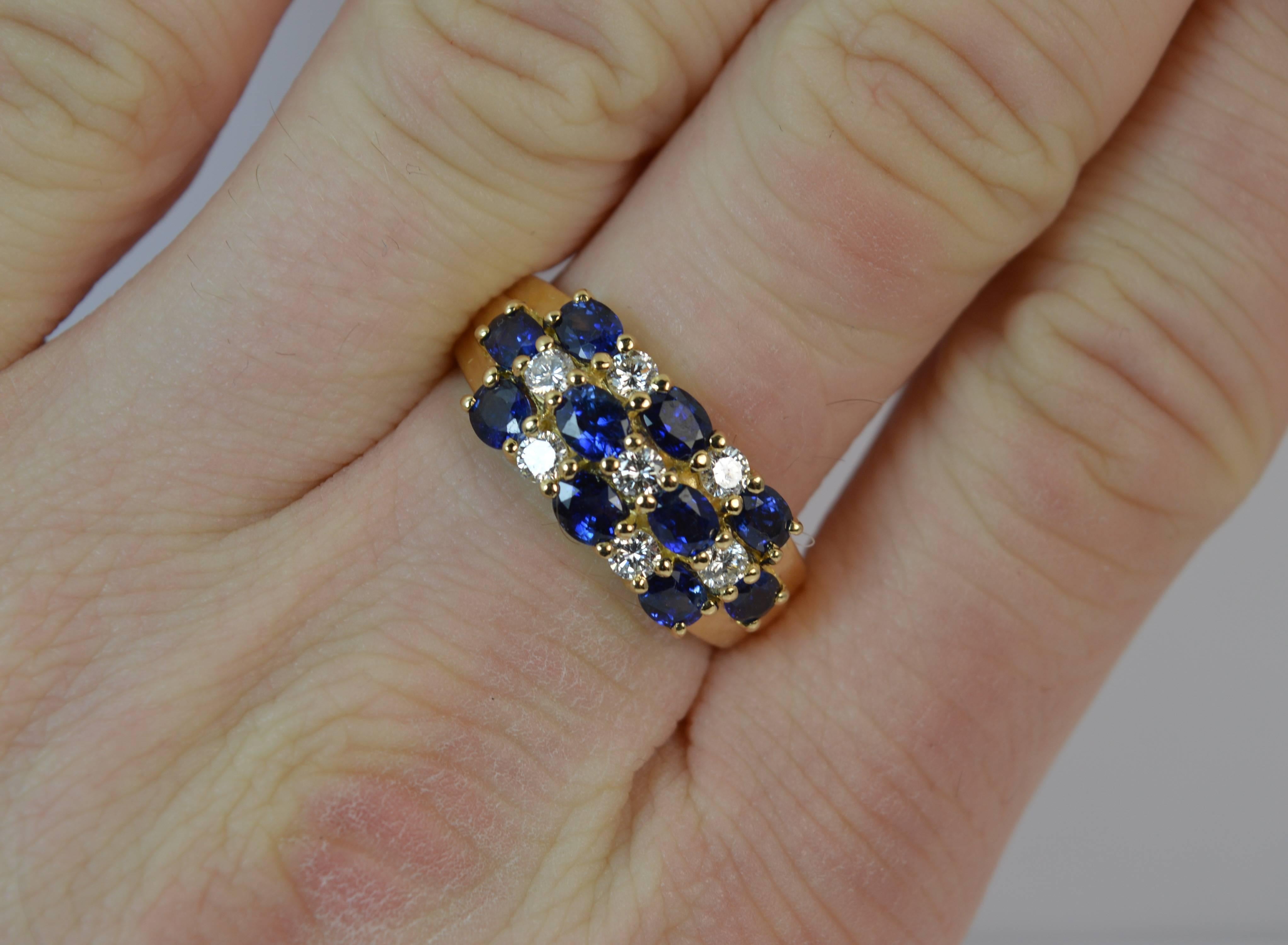 
A stunning ladies Sapphire and Diamond cluster ring.

Designed with three rows of alternating natural sapphires and diamonds.

​VS1 bright, white and sparkly round brilliant cut diamonds and oval cut vibrant vivid blue sapphires creating a 20mm x