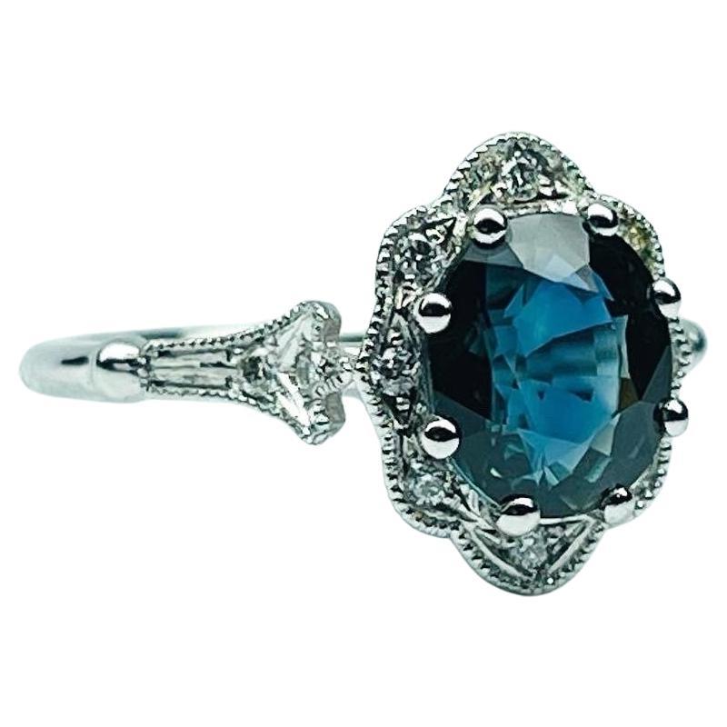 Such an amazing ring, made in vintage style with a 1.50 carats center, the sapphire is a beautiful greenish blue color, the diamonds are VS clarity and F color, the metal is 14KT white gold. Its a stunning engagement ring. Ring is in size 7 and can