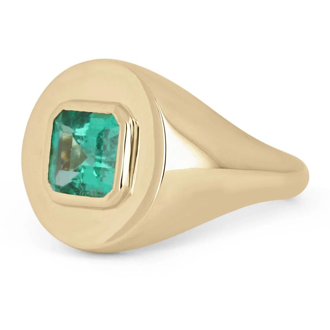 Displayed is a bluish-green Colombian emerald signet ring in 18K yellow gold. This gorgeous solitaire ring carries a full 1.50-carat emerald in a sleek signet setting. The emerald has excellent clarity and luster that will have you dazing into its