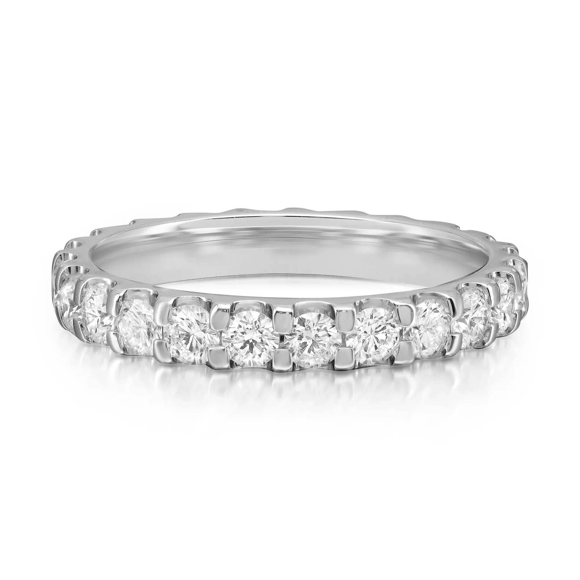 This classic diamond eternity band ring makes a standout addition to your jewelry collection. It features 24 prong set round brilliant cut sparkling diamonds, crafted in 14K white gold. Total diamond weight: 1.50 carats. Diamond quality: color H-I