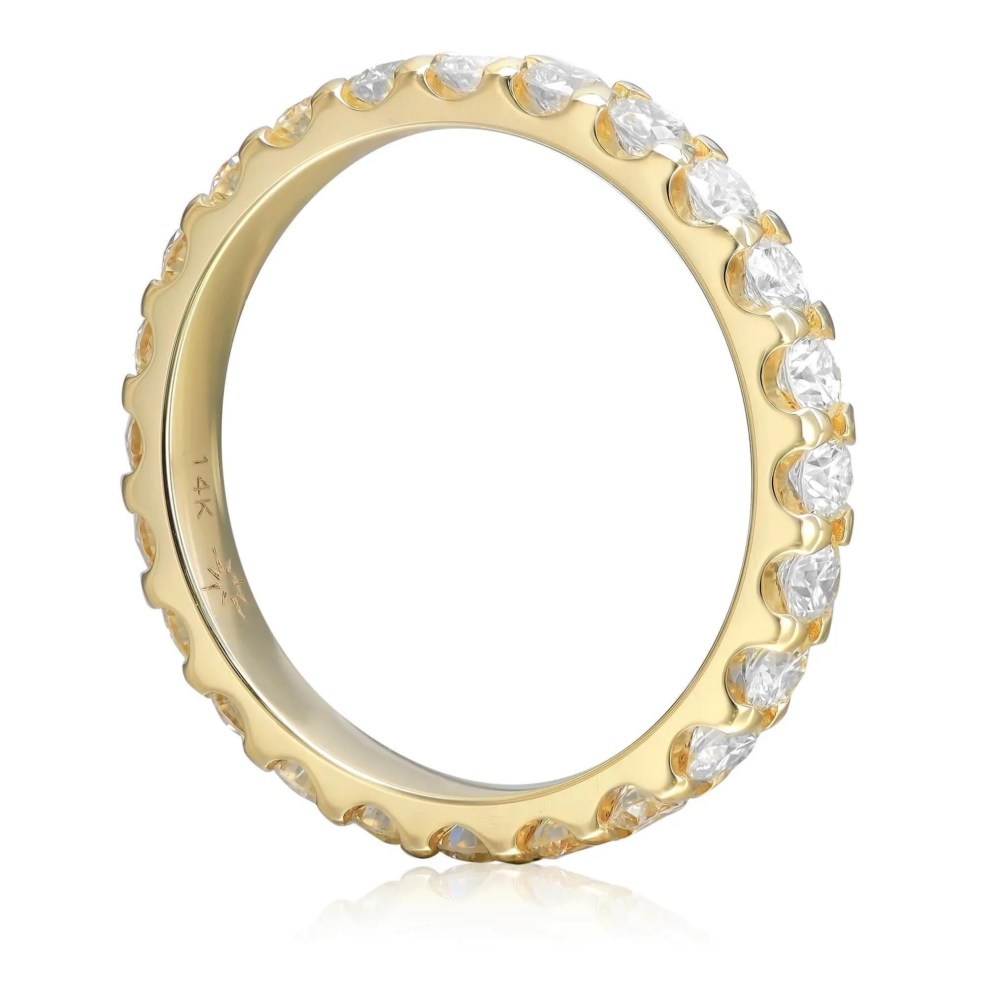 This classic diamond eternity band ring makes a standout addition to your jewelry collection. It features 24 prong set round brilliant cut sparkling diamonds, crafted in 14K yellow gold. Total diamond weight: 1.50 carats. Diamond quality: color H-I