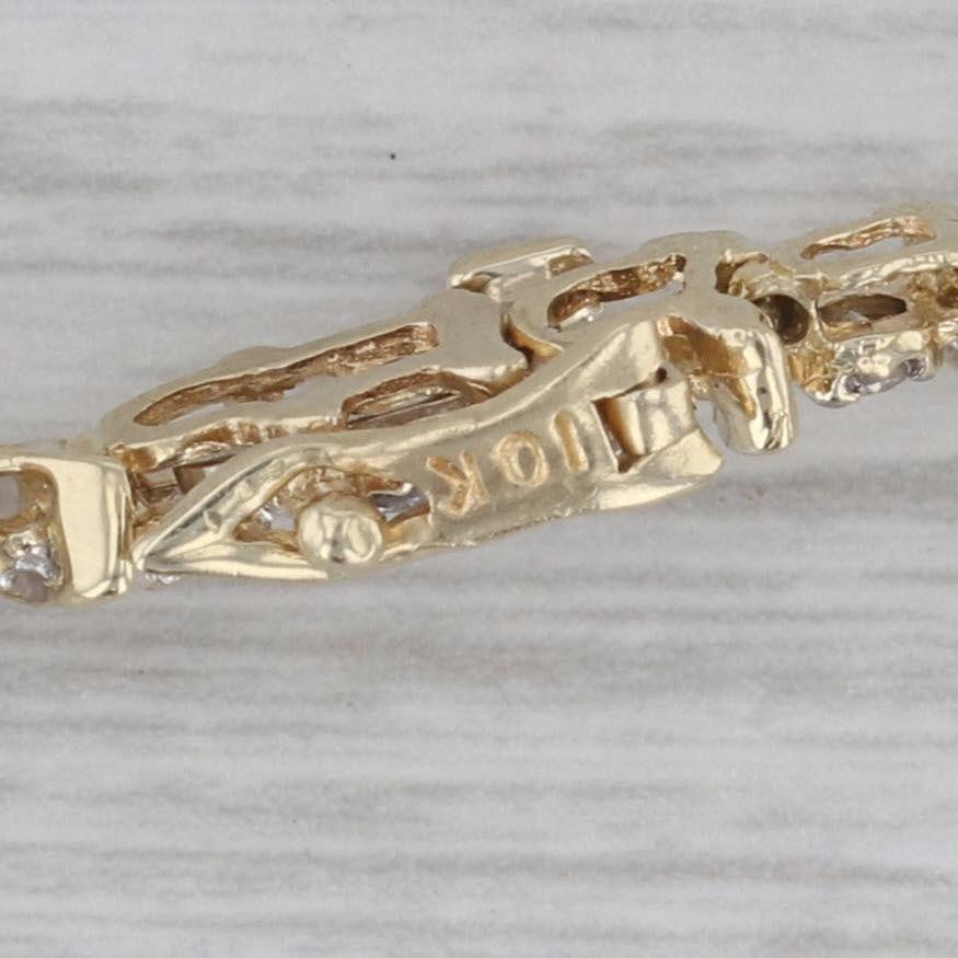 Gemstone Information:
- Natural Diamonds -
Total Carats - 1.50ctw
Cut - Round Brilliant
Color - K - M
Clarity - I2 - I3
Please note there are surface reaching inclusions.

Metal: 10k Yellow Gold
Weight: 10.9 Grams 
Stamps: 10k
Chain Style:
