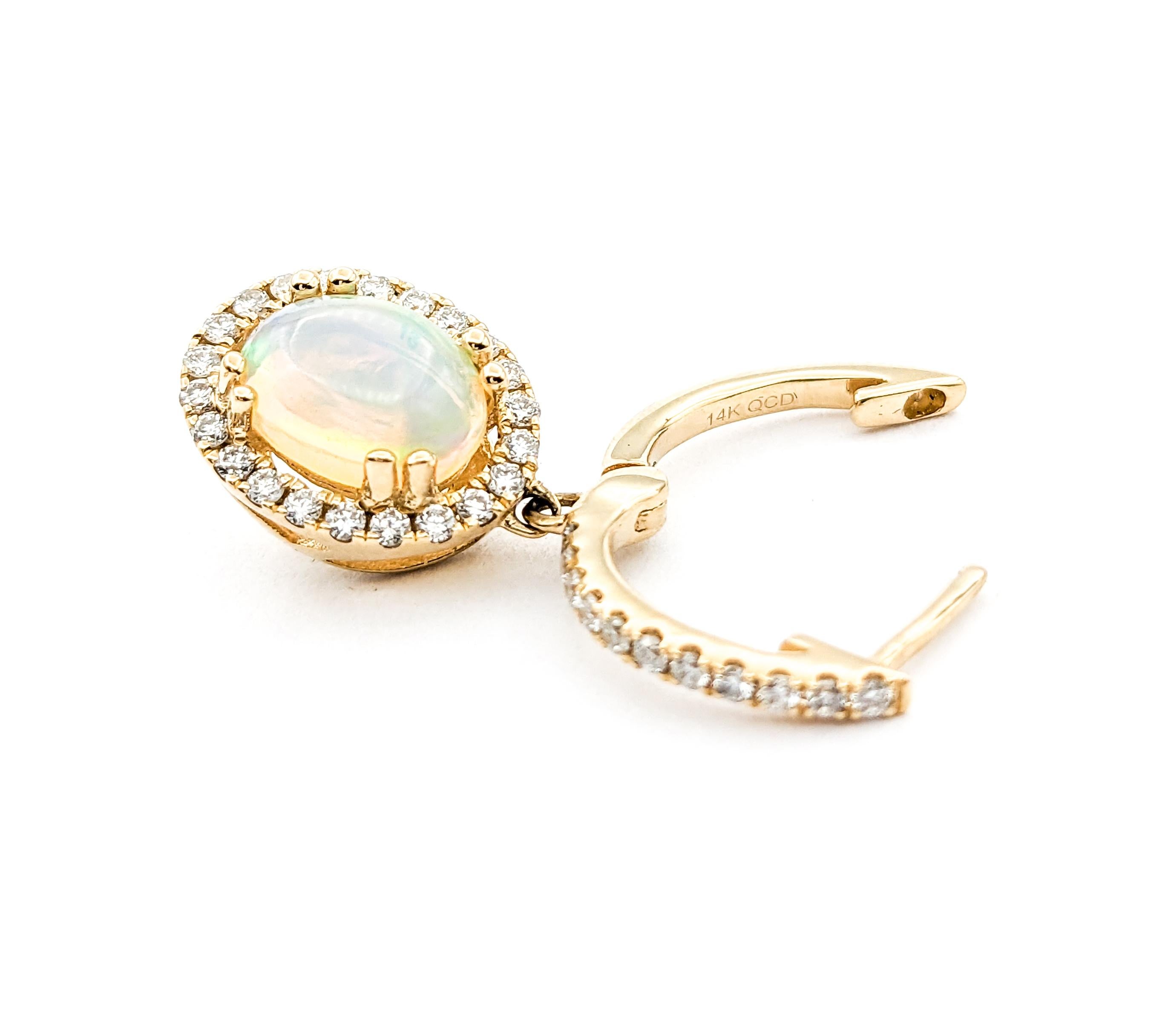 1.50ctw Opal & Diamond leverback Drop Earrings In Yellow Gold

Introducing these exquisite gemstone fashion earrings crafted in 14kt yellow gold. These earrings feature .46ctw of diamonds paired with a stunning 1.50ctw of opal in a leverback drop