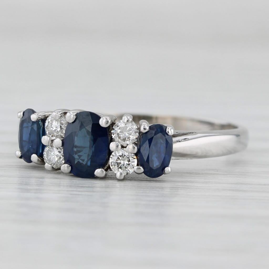 Gemstone Information:
- Natural Sapphires -
Total Carats - 1.25ctw
Cut - Oval Brilliant
Color - Dark Blue
Treatment - Heated

- Natural Diamonds -
Total Carats - 0.25ctw
Cut - Round Brilliant
Color - G - H
Clarity - SI2 - I1

Metal: 14k White