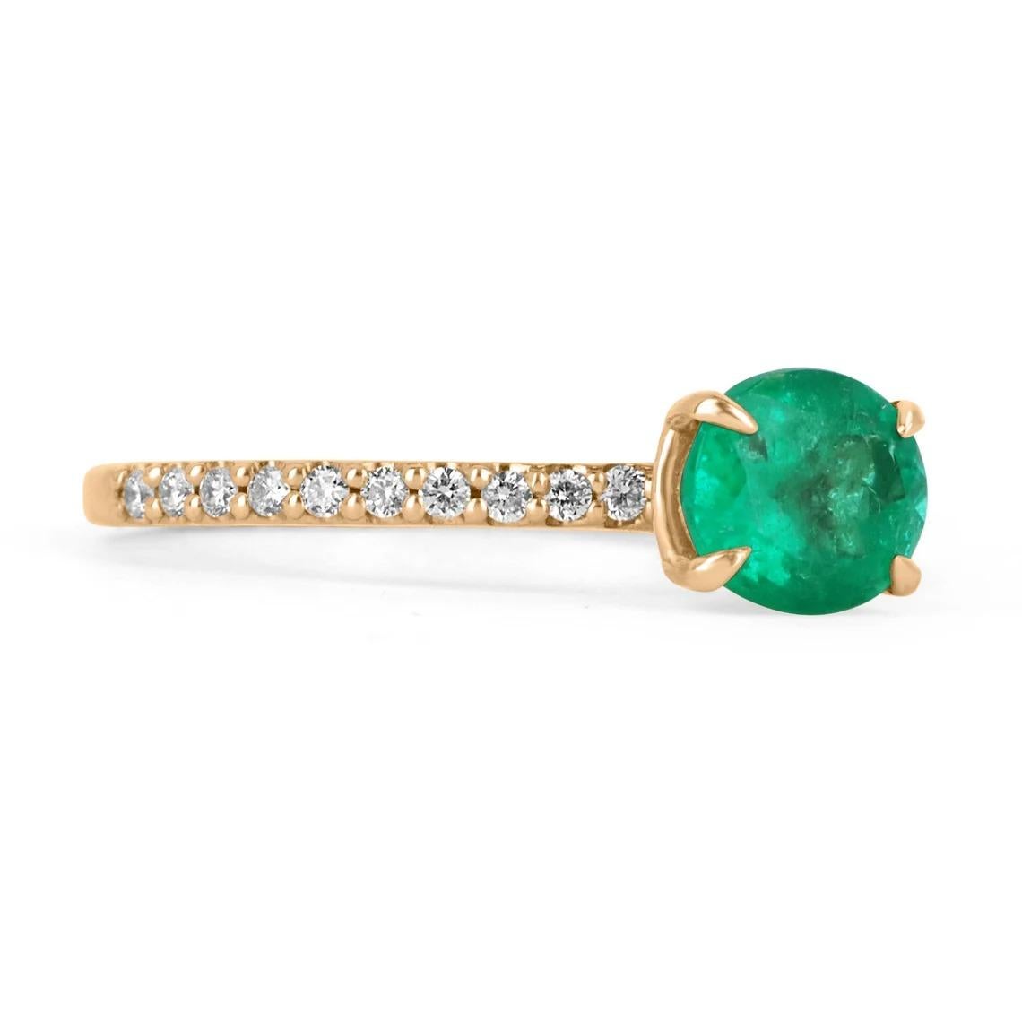 Elegantly displayed is a natural, oval cut Colombian emerald and diamond accent engagement ring. The center gem is a fine quality, oval cut, emerald filled with life and brilliance! Among the emeralds impressive qualities are its vibrant color and