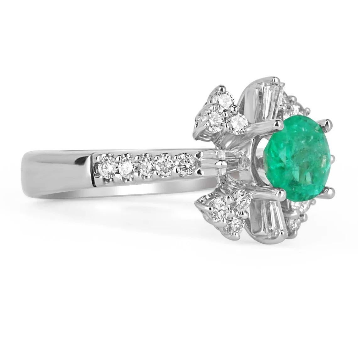 Featured here is a one of a kind, emerald and diamond statement ring. The center stone, carries a full 0.85-carats, of pure green beauty. Sourced from the famous mines of Muzo, Colombia, this stone displays a lovely vivid, medium-green color and