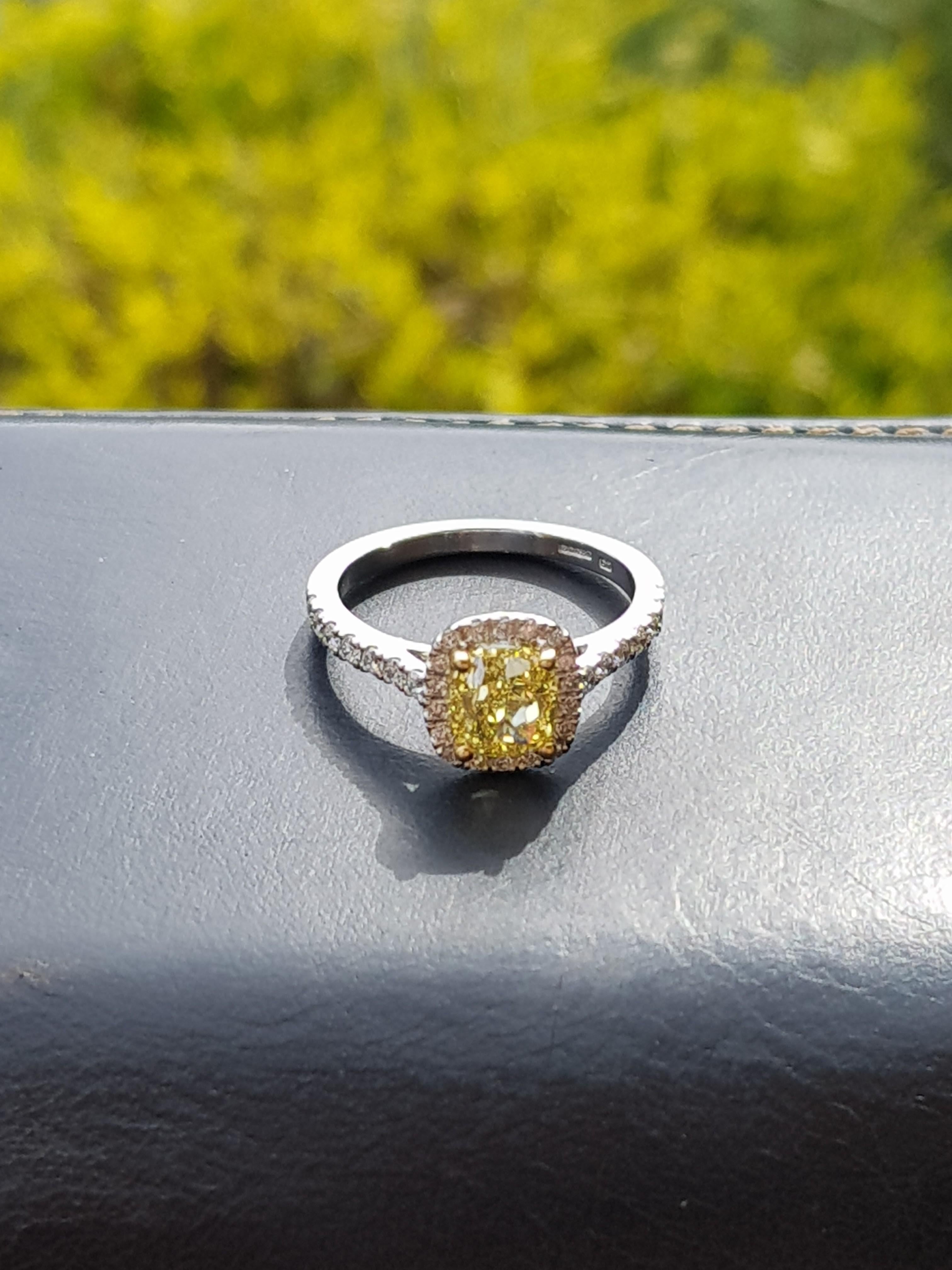 Artisan 1.51 Carat Cushion Cut Fancy Intense Yellow Diamond Halo Engagement Ring For Sale